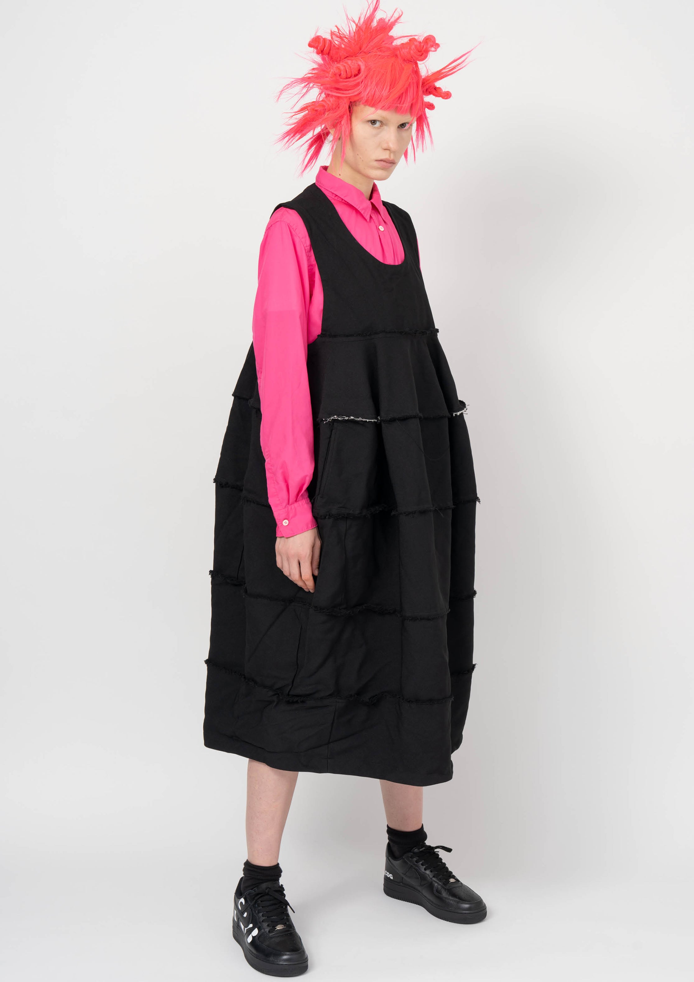 Fashion model wearing a BLACK COMME DES GARÇONS AW26 outfit