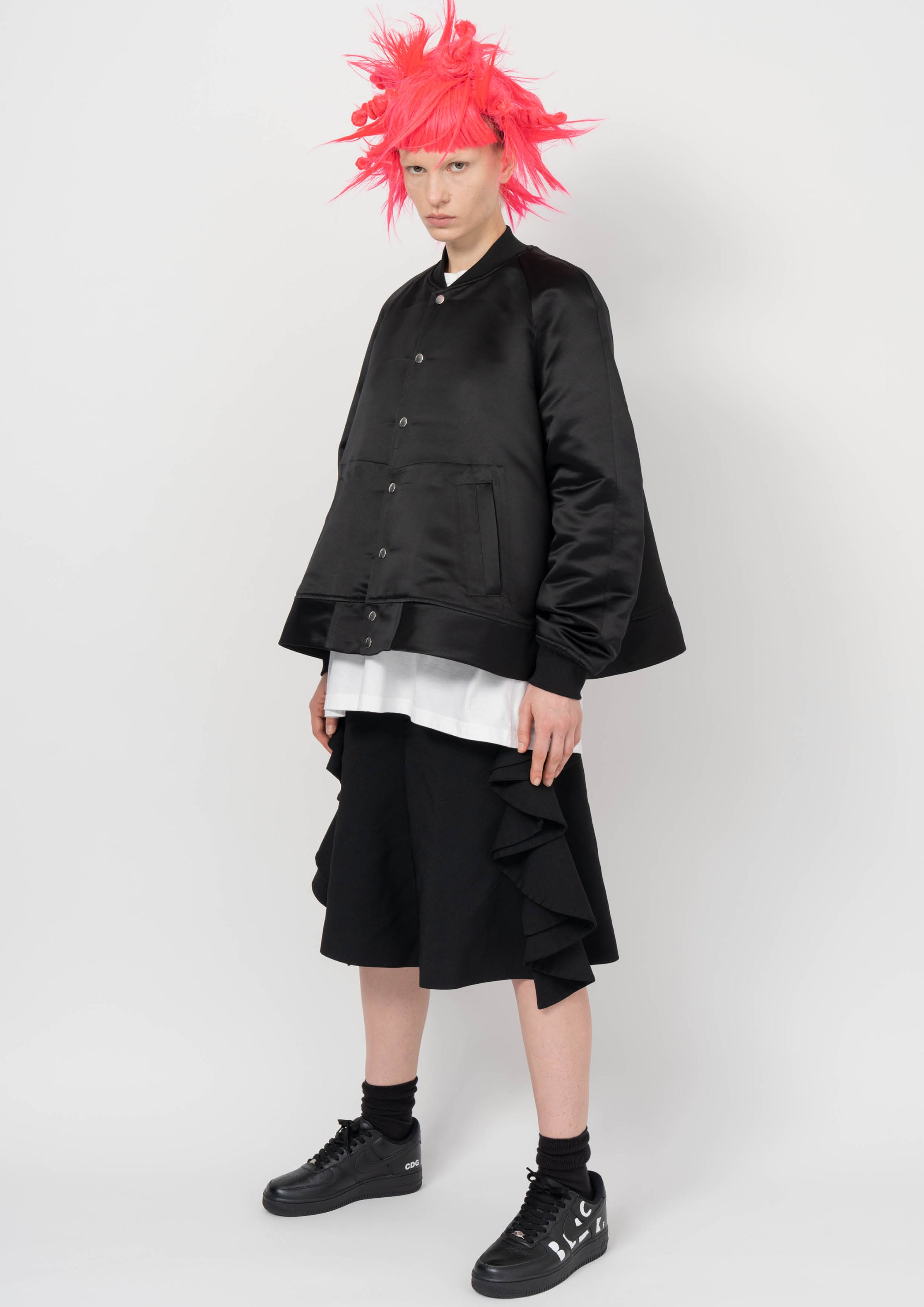 Fashion model wearing a BLACK COMME DES GARÇONS AW26 outfit