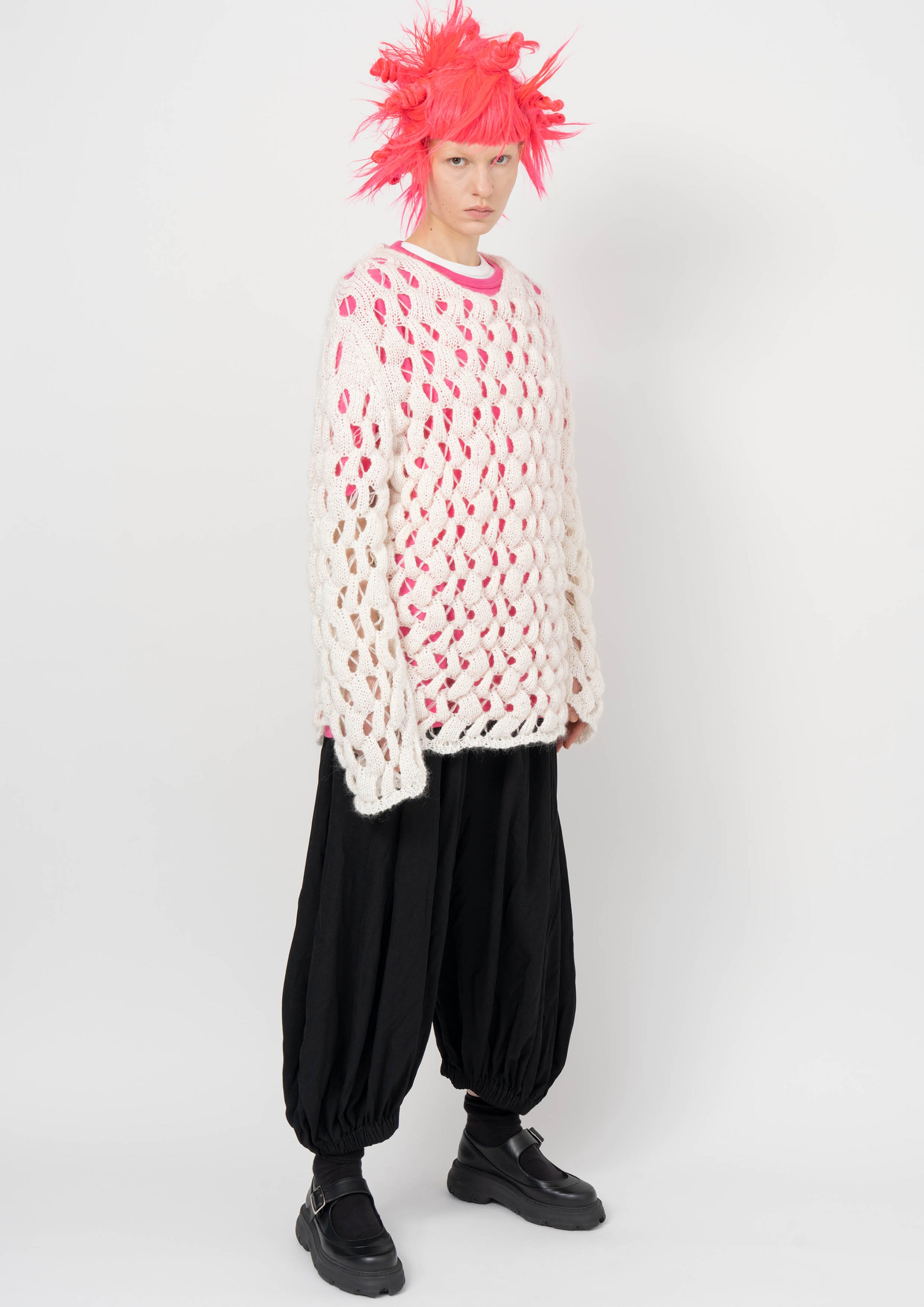 Fashion model wearing a BLACK COMME DES GARÇONS AW26 outfit