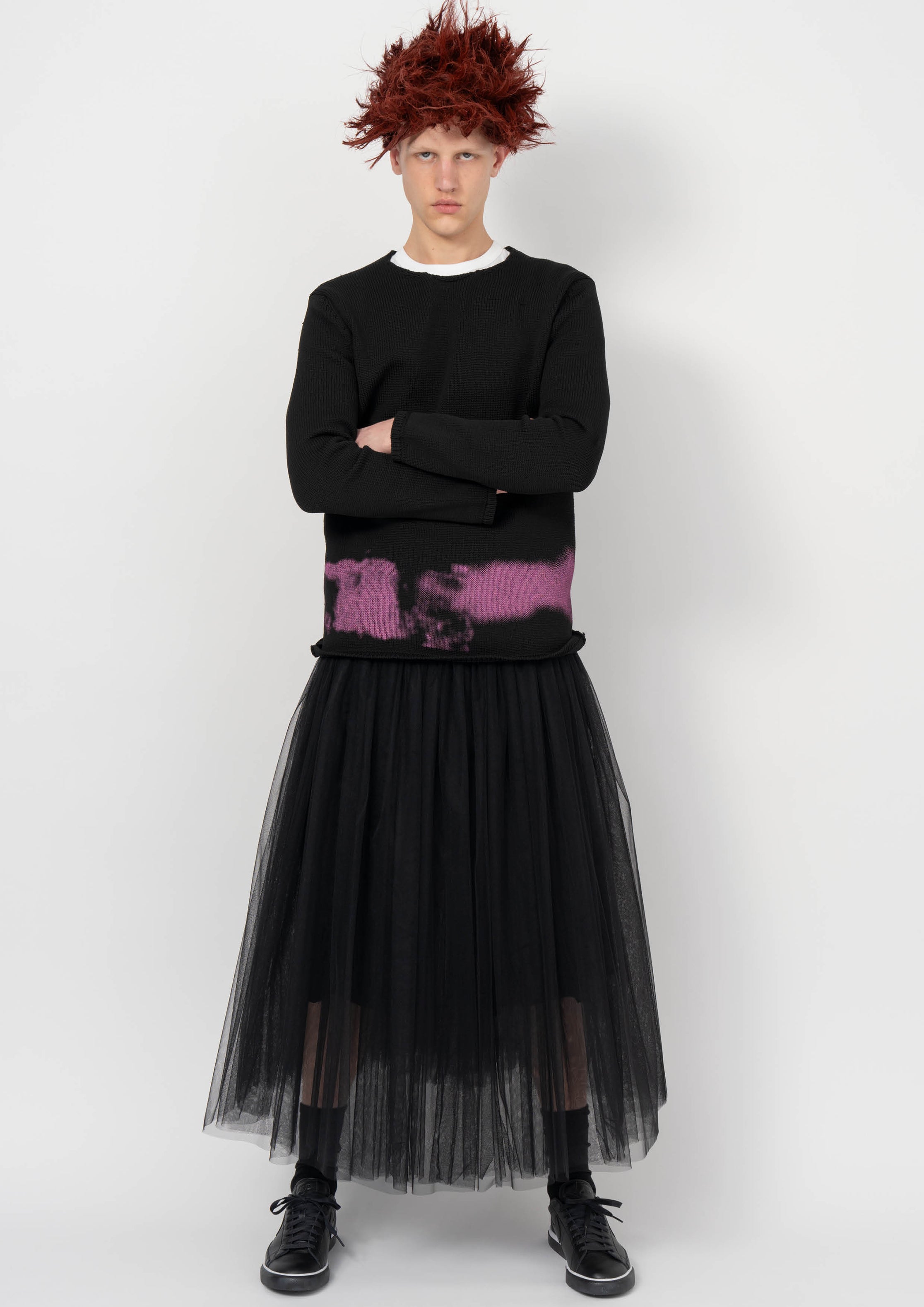 Fashion model wearing a BLACK COMME DES GARÇONS AW26 outfit
