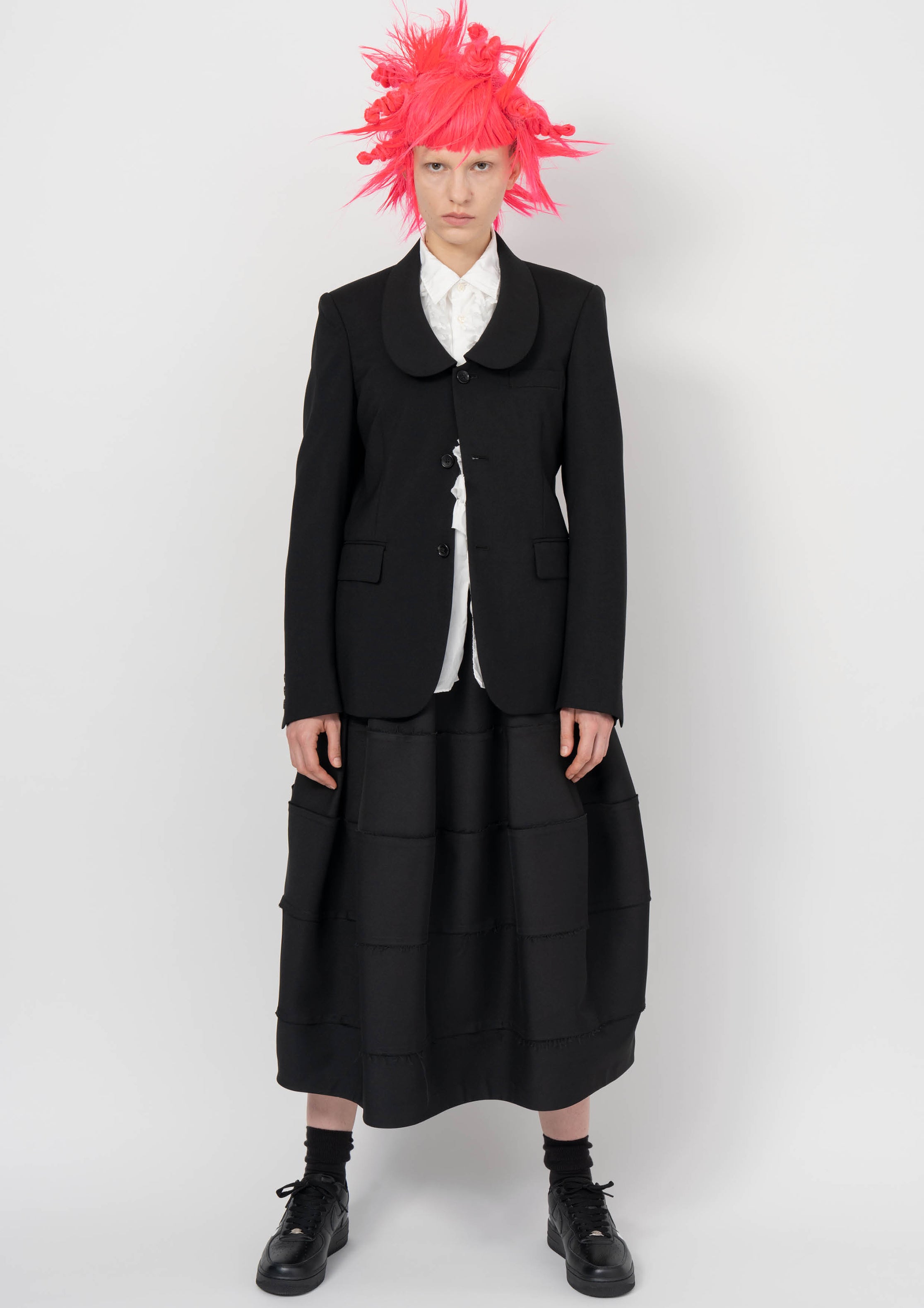 Fashion model wearing a BLACK COMME DES GARÇONS AW26 outfit