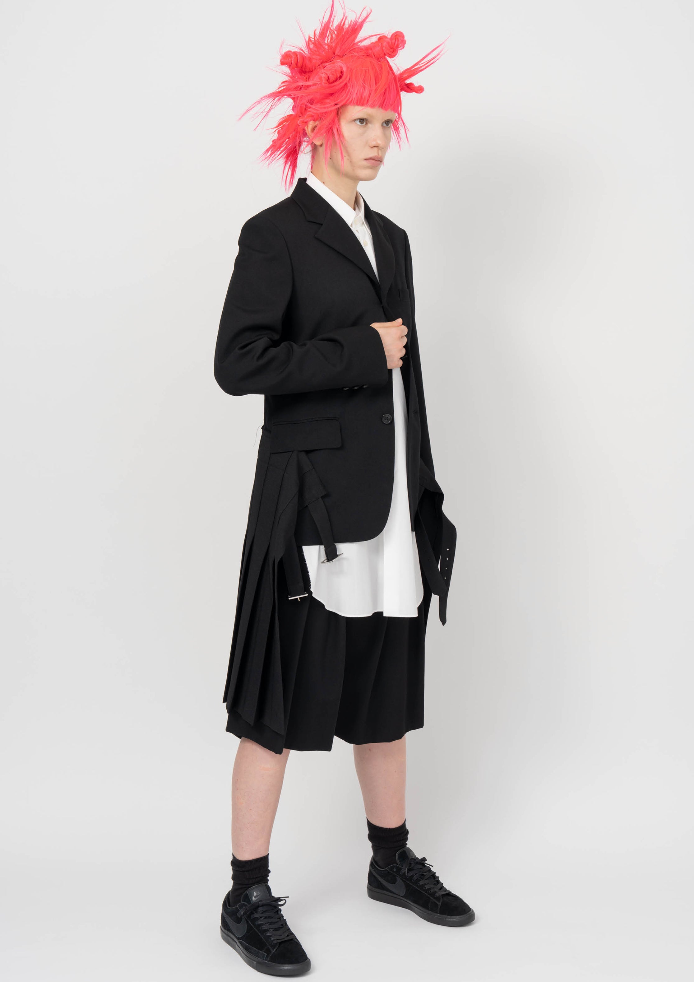 Fashion model wearing a BLACK COMME DES GARÇONS AW26 outfit
