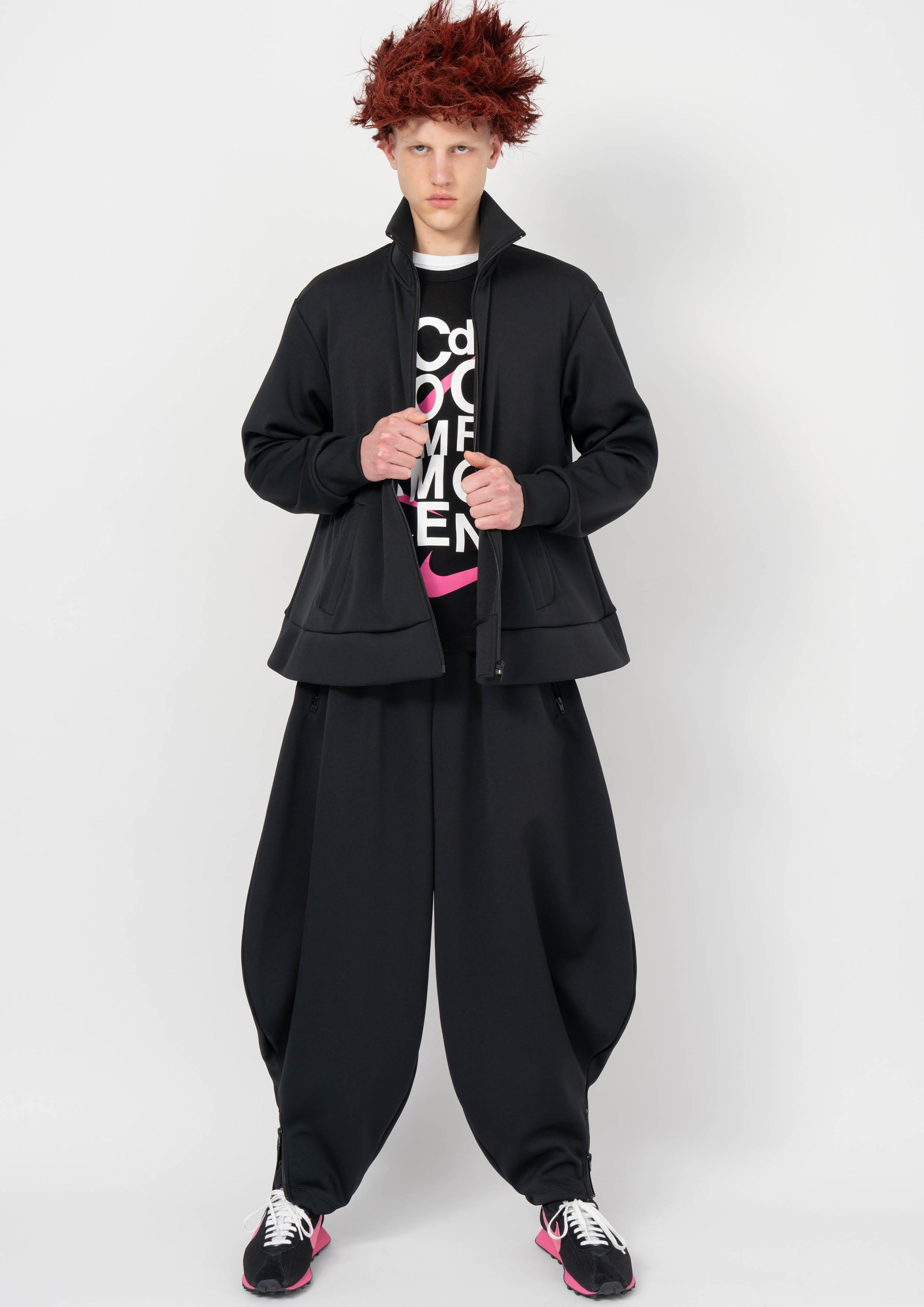 Fashion model wearing a BLACK COMME DES GARÇONS AW26 outfit