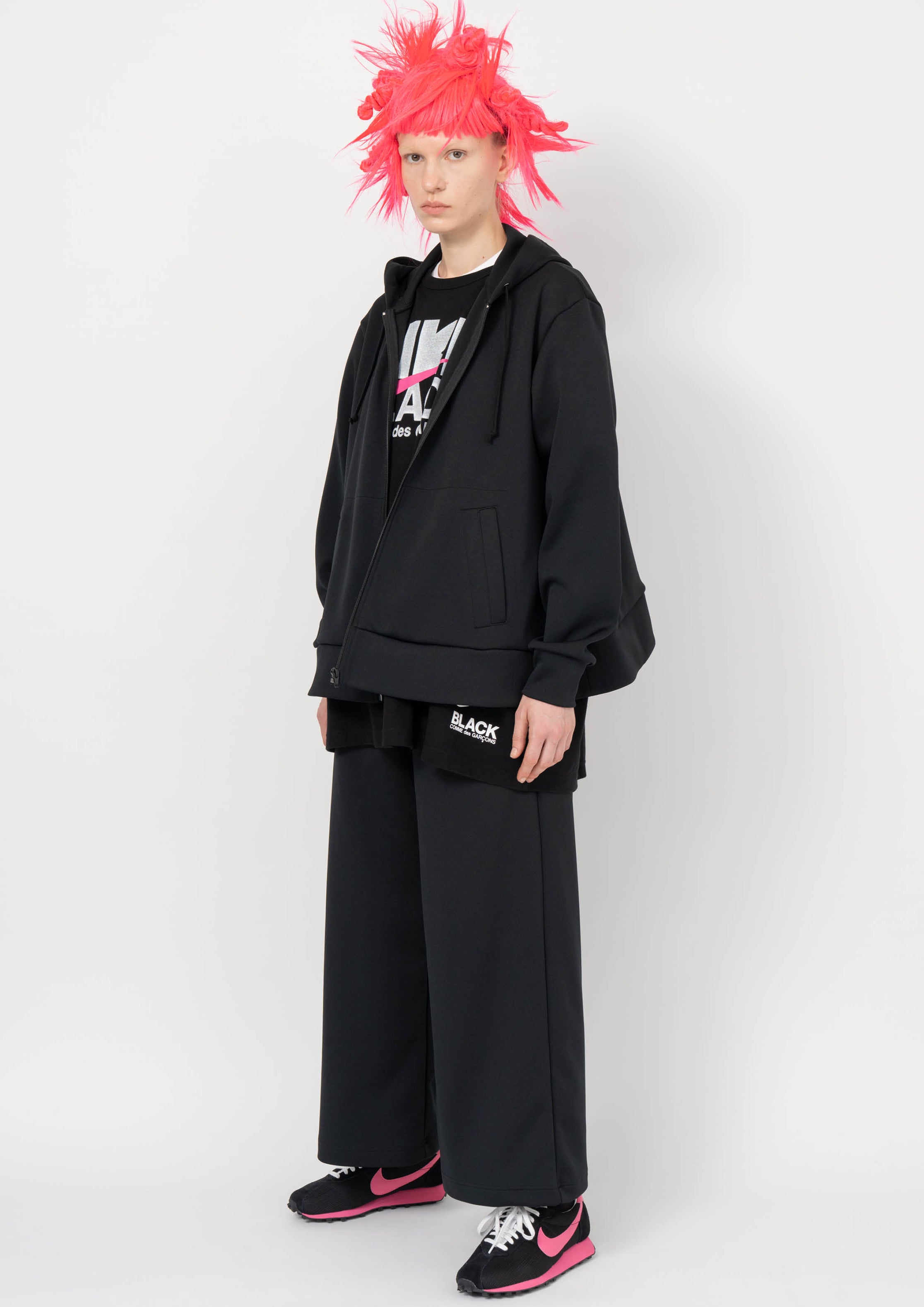 Fashion model wearing a BLACK COMME DES GARÇONS AW26 outfit