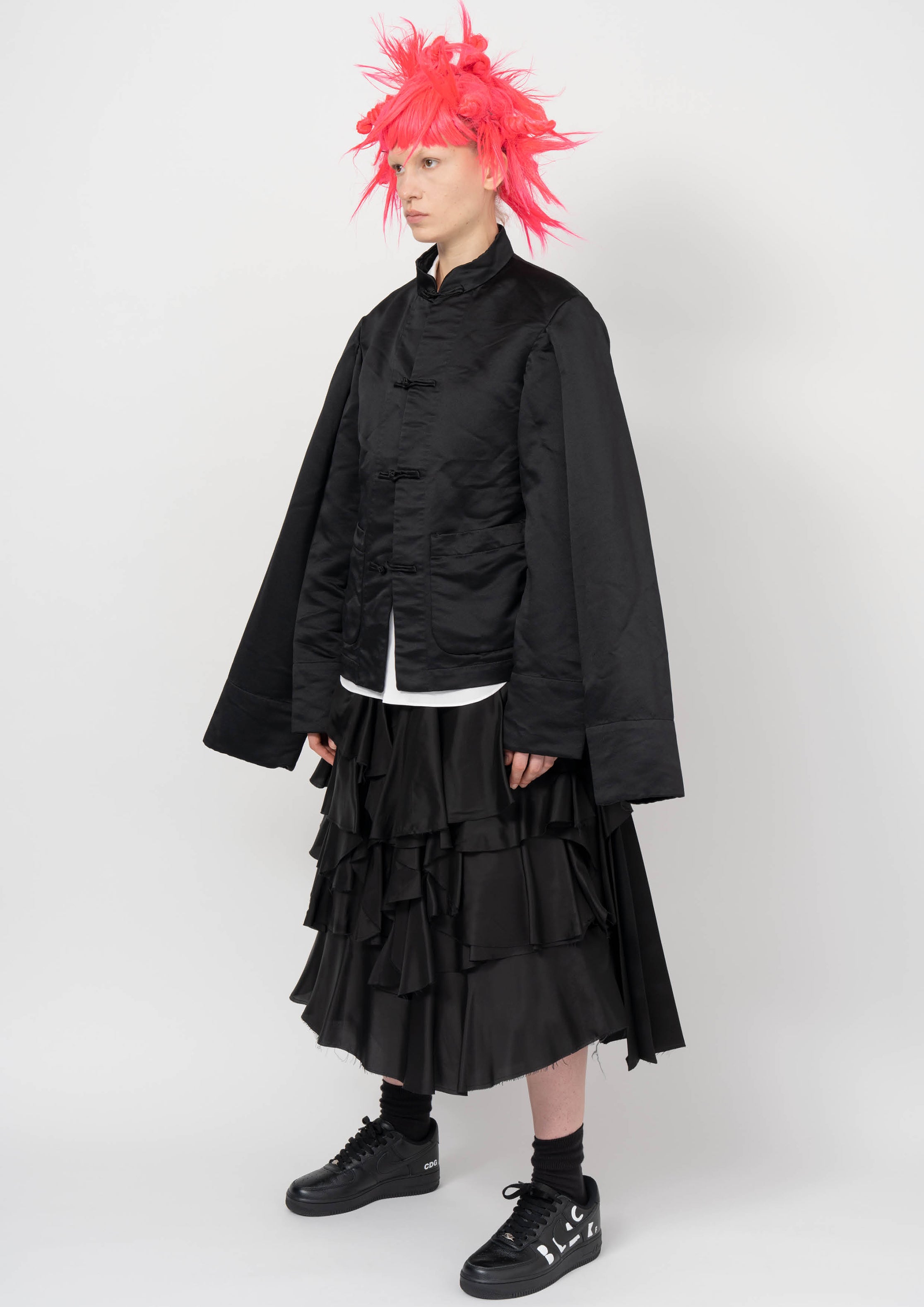 Fashion model wearing a BLACK COMME DES GARÇONS AW26 outfit