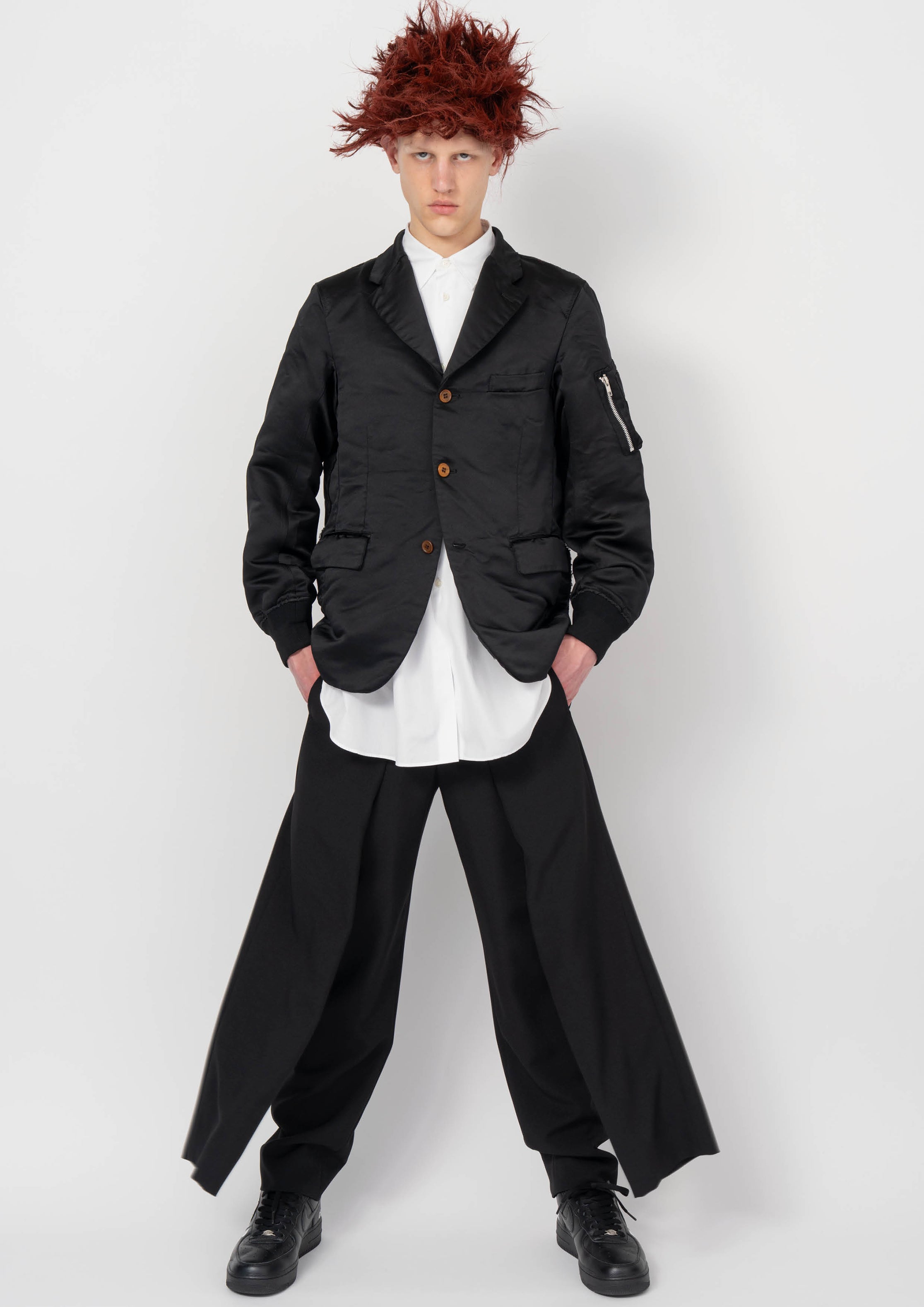 Fashion model wearing a BLACK COMME DES GARÇONS AW26 outfit