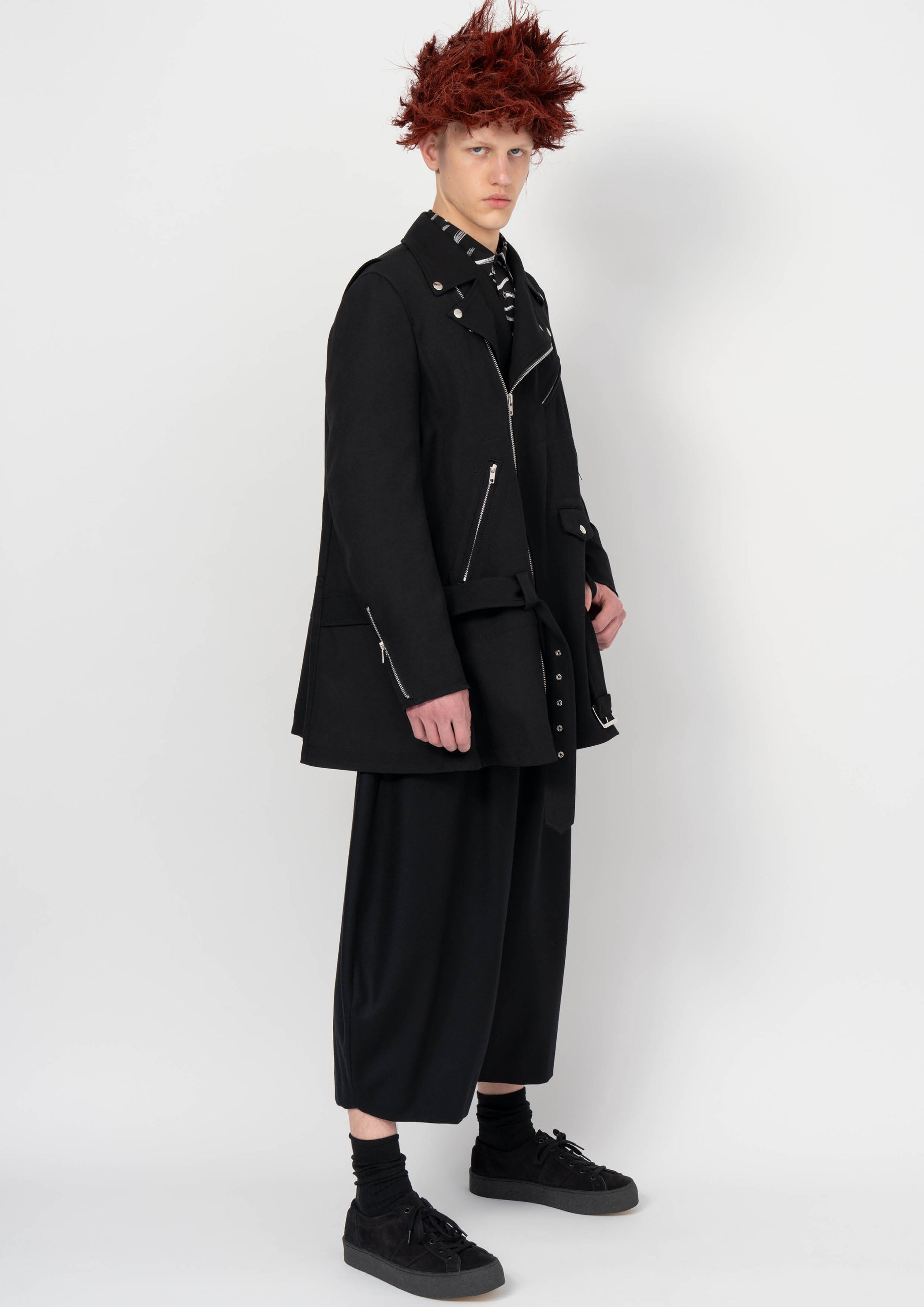 Fashion model wearing a BLACK COMME DES GARÇONS AW26 outfit