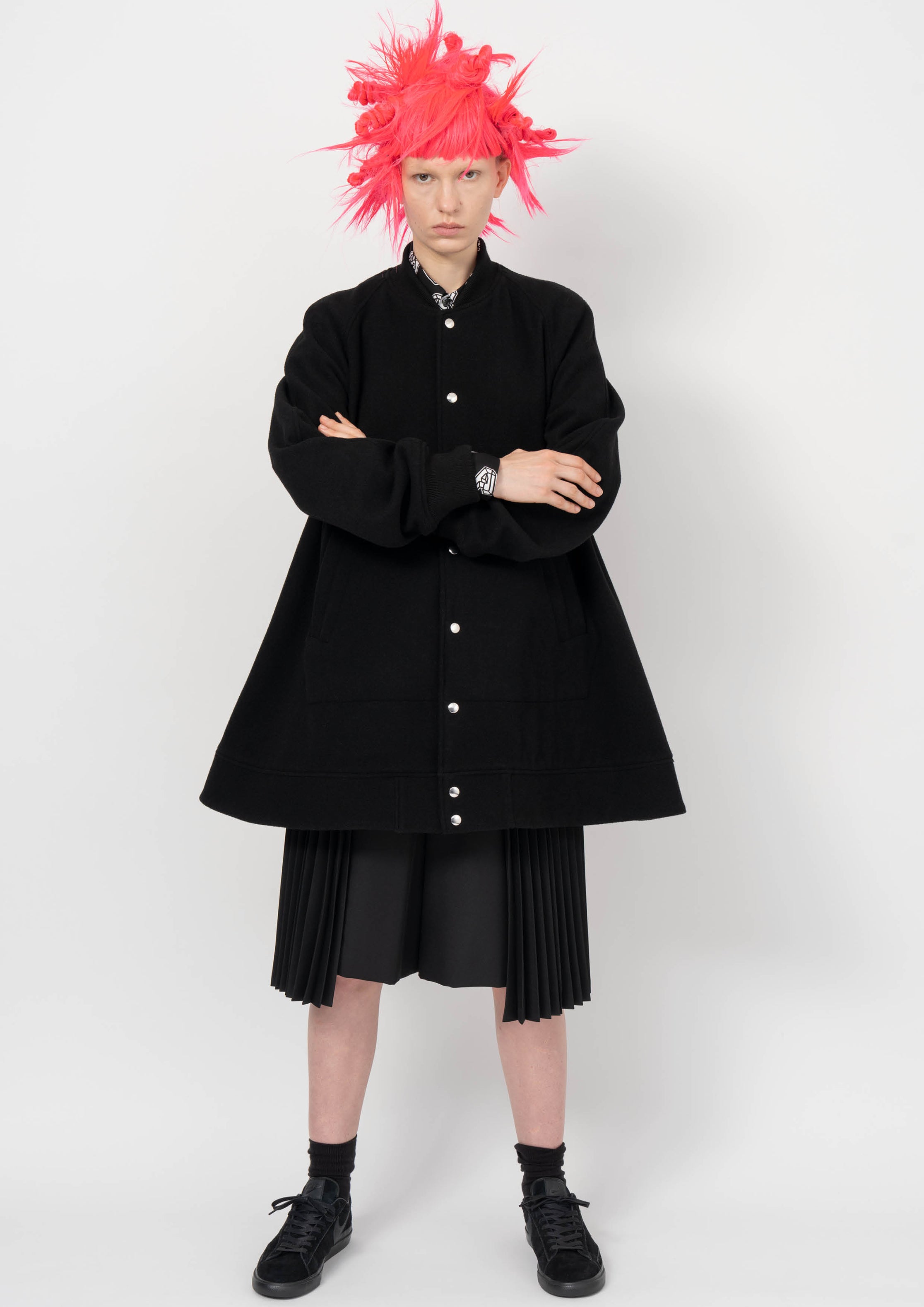 Fashion model wearing a BLACK COMME DES GARÇONS AW26 outfit