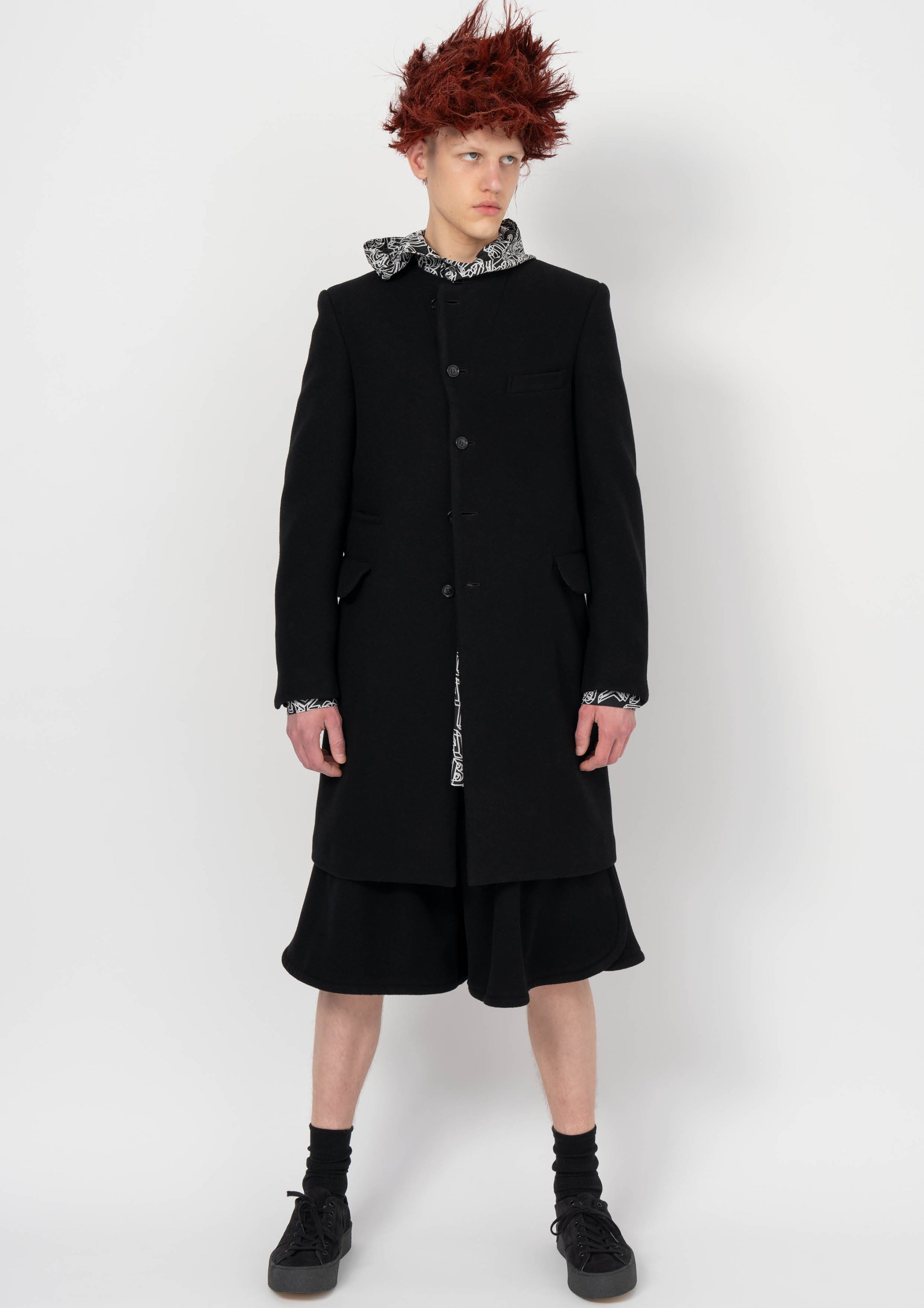Fashion model wearing a BLACK COMME DES GARÇONS AW26 outfit