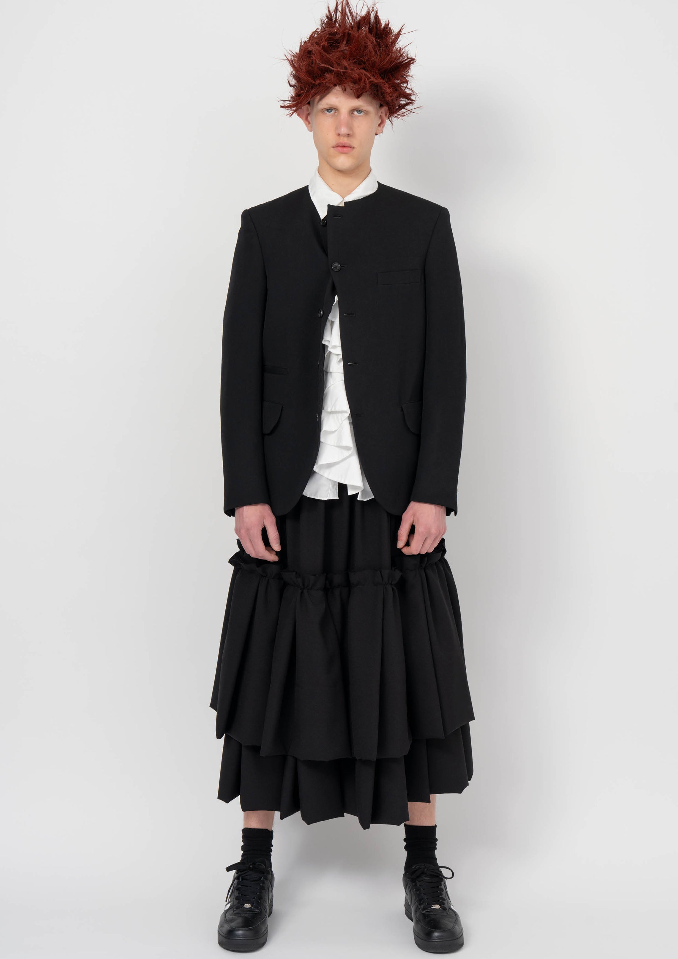 Fashion model wearing a BLACK COMME DES GARÇONS AW26 outfit