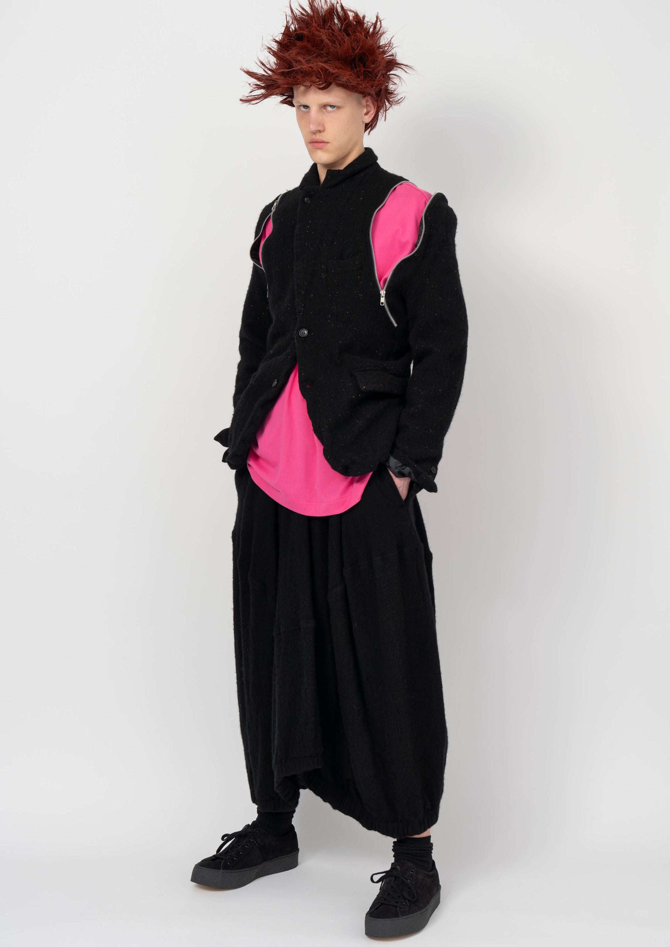 Fashion model wearing a BLACK COMME DES GARÇONS AW26 outfit