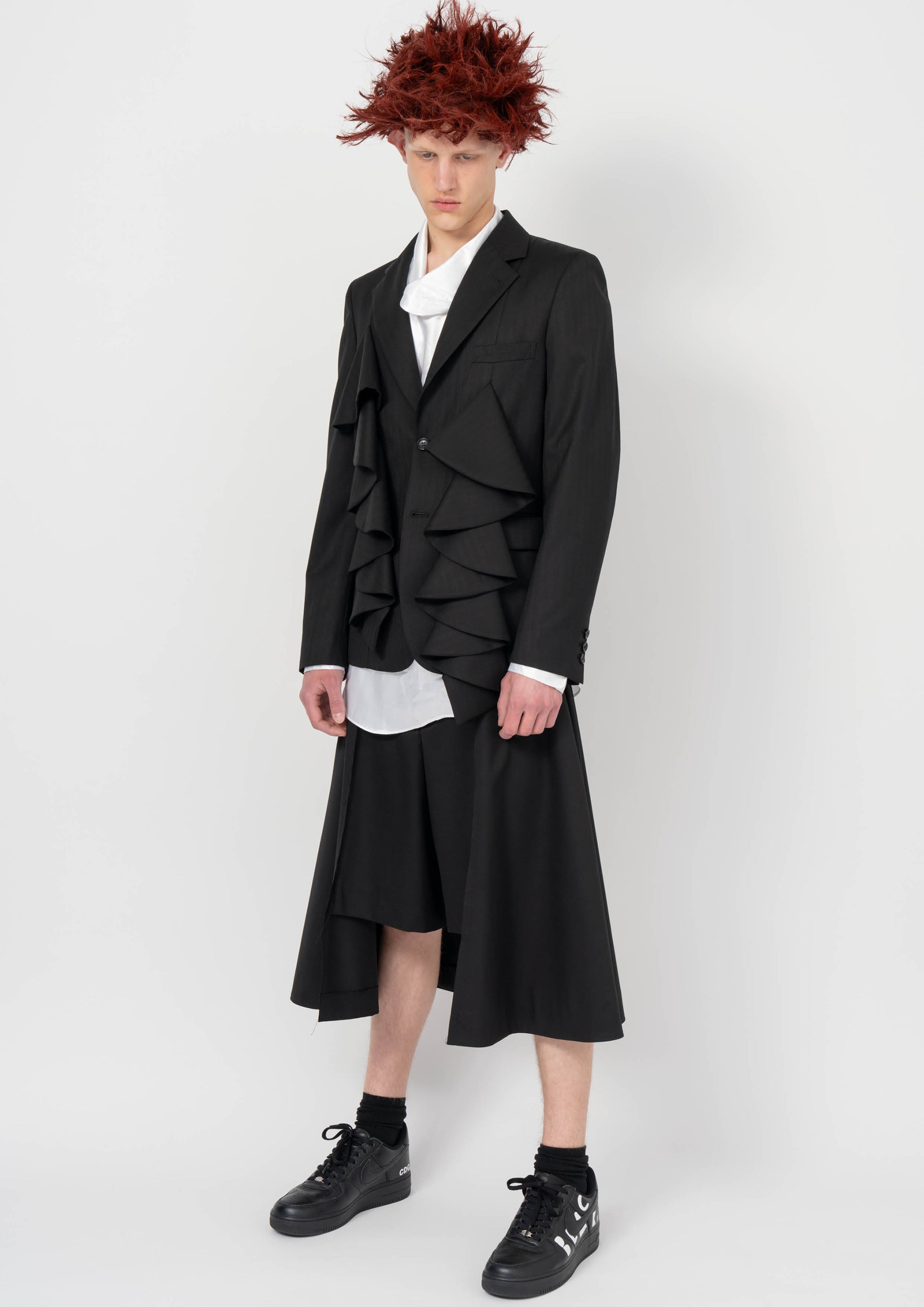 Fashion model wearing a BLACK COMME DES GARÇONS AW26 outfit