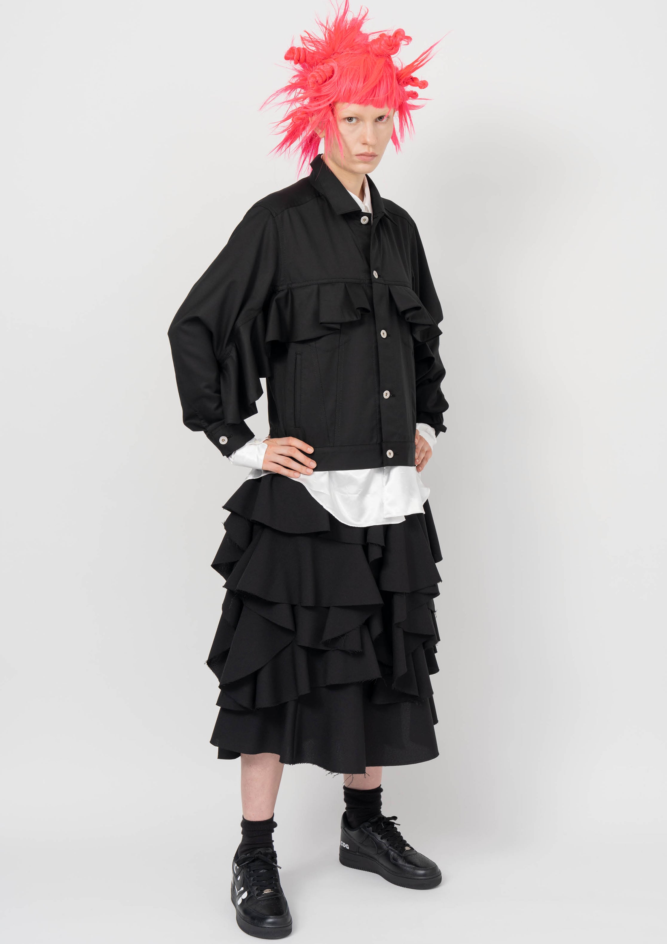 Fashion model wearing a BLACK COMME DES GARÇONS AW26 outfit