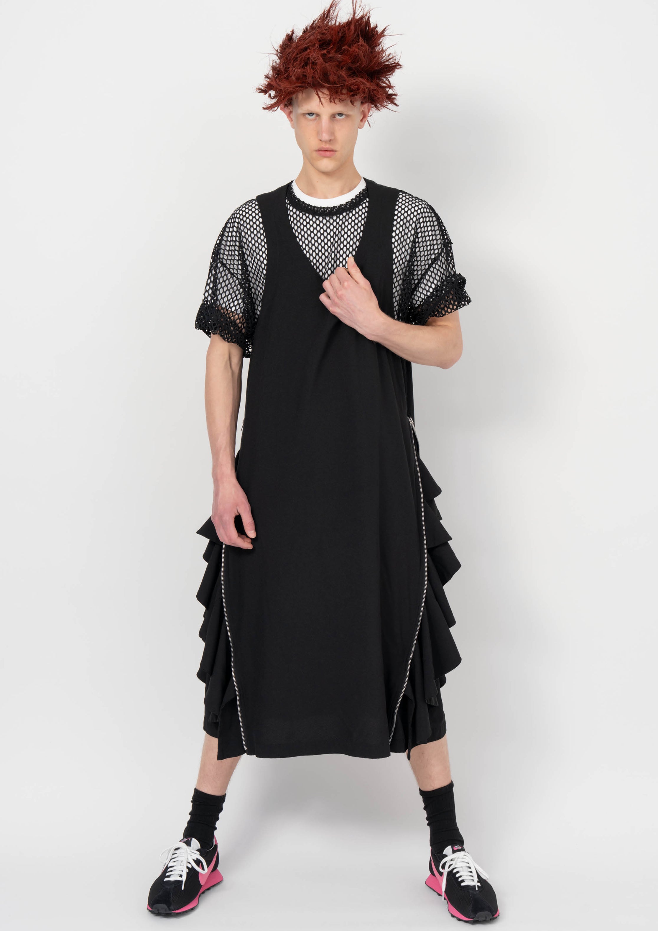 Fashion model wearing a BLACK COMME DES GARÇONS AW26 outfit