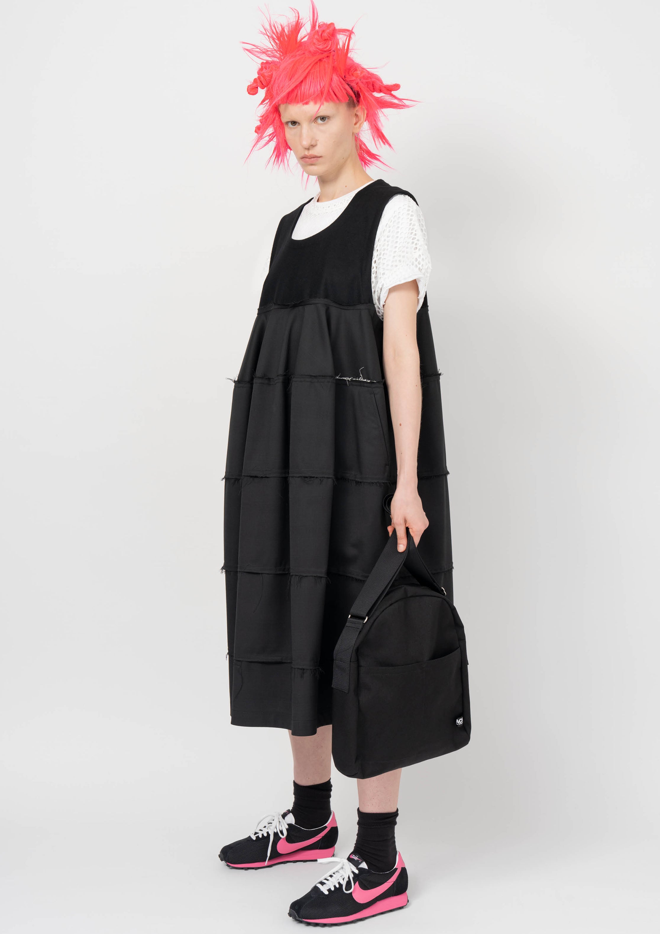 Fashion model wearing a BLACK COMME DES GARÇONS AW26 outfit