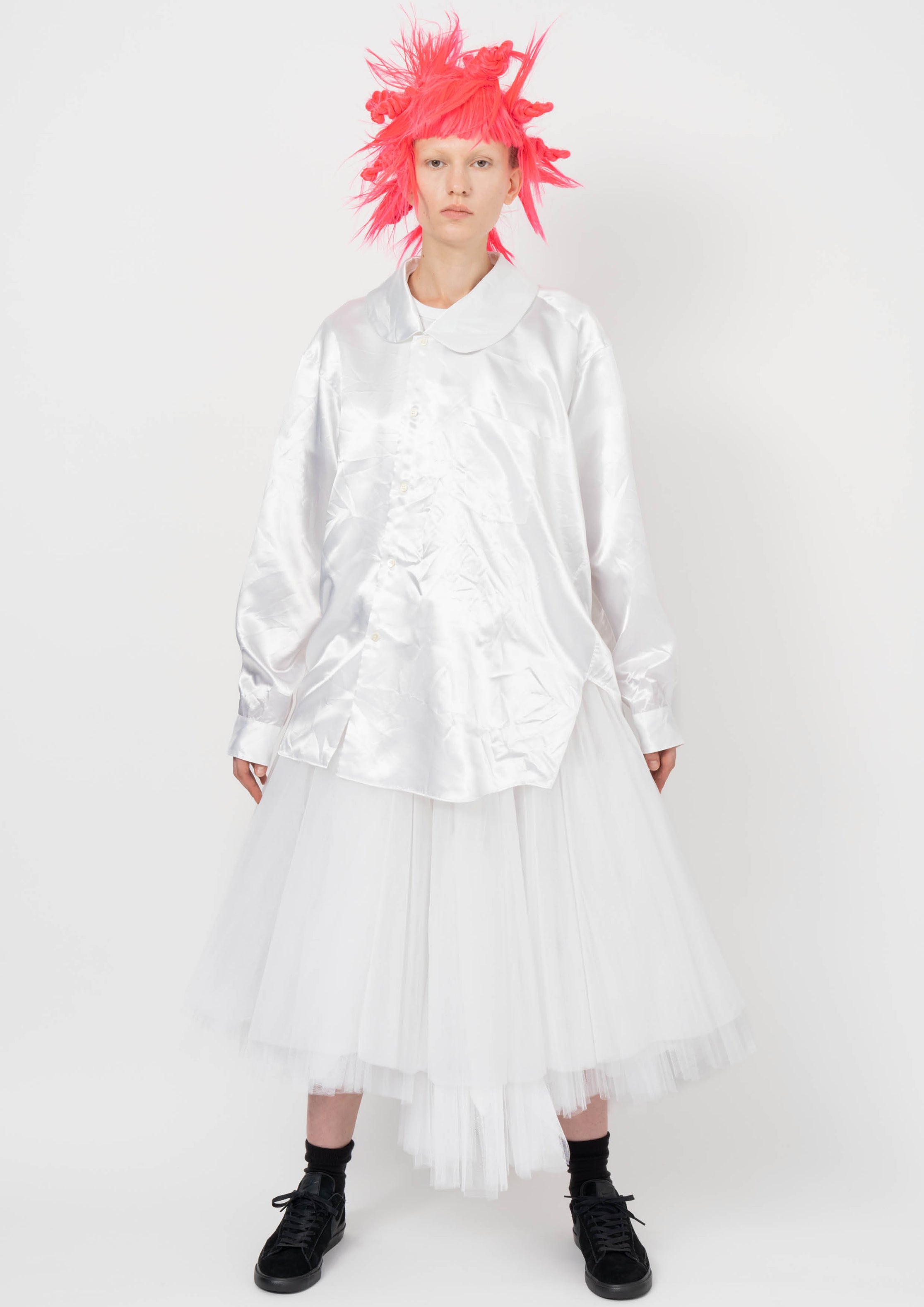 Fashion model wearing a BLACK COMME DES GARÇONS AW26 outfit
