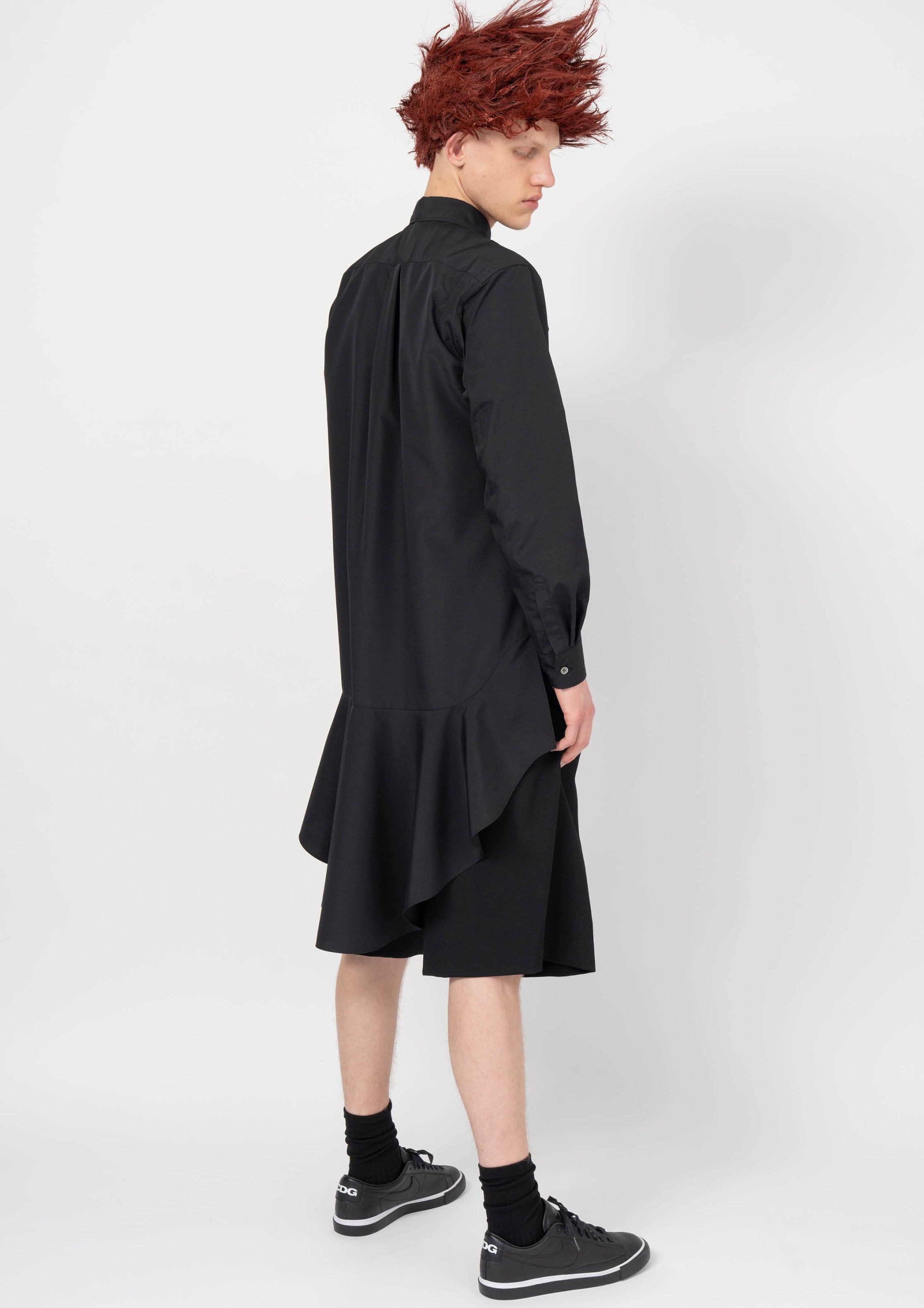 Fashion model wearing a BLACK COMME DES GARÇONS AW26 outfit