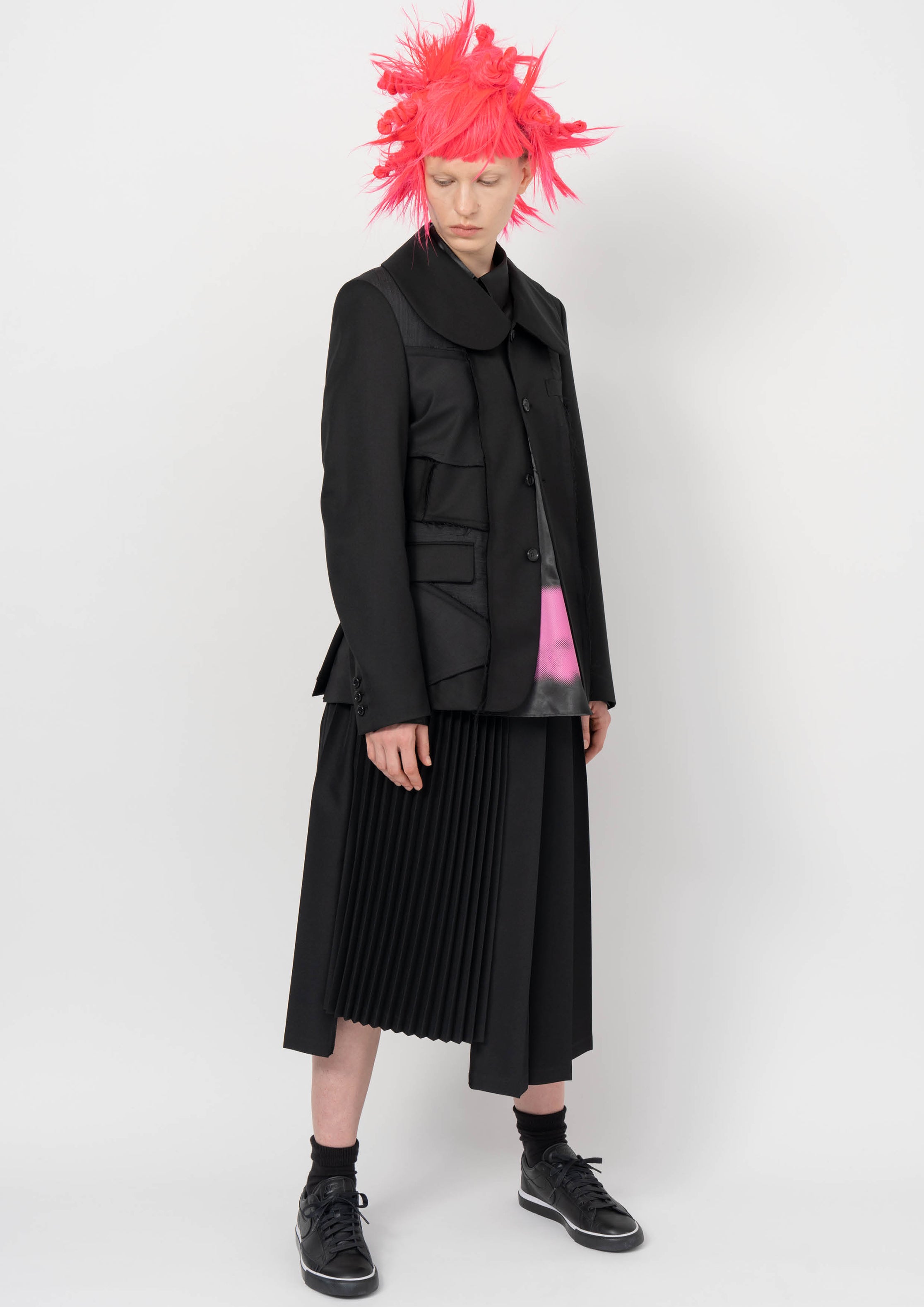 Fashion model wearing a BLACK COMME DES GARÇONS AW26 outfit