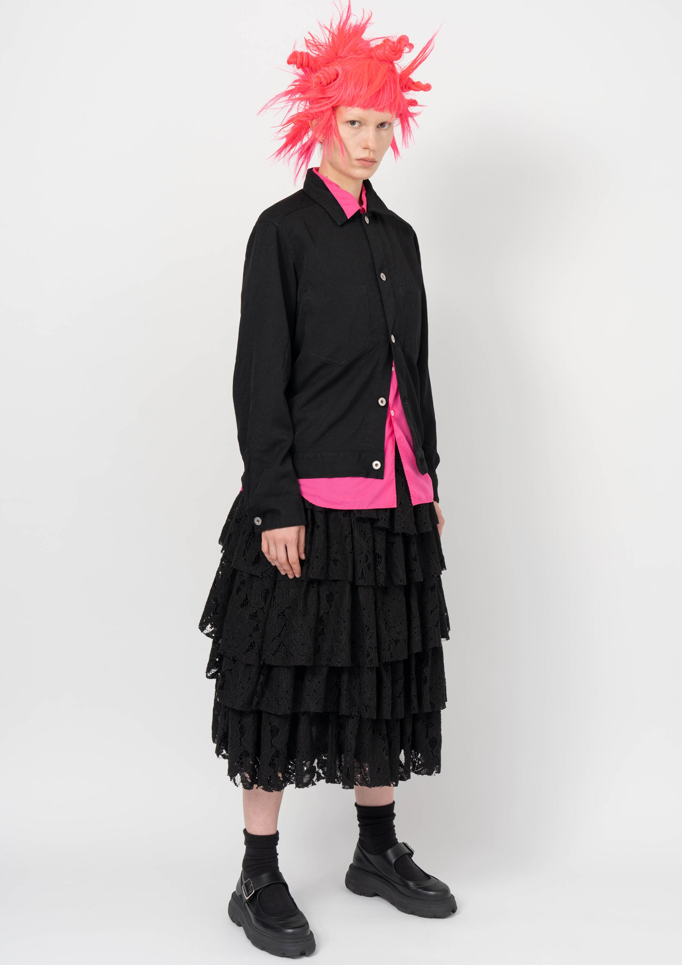 Fashion model wearing a BLACK COMME DES GARÇONS AW26 outfit