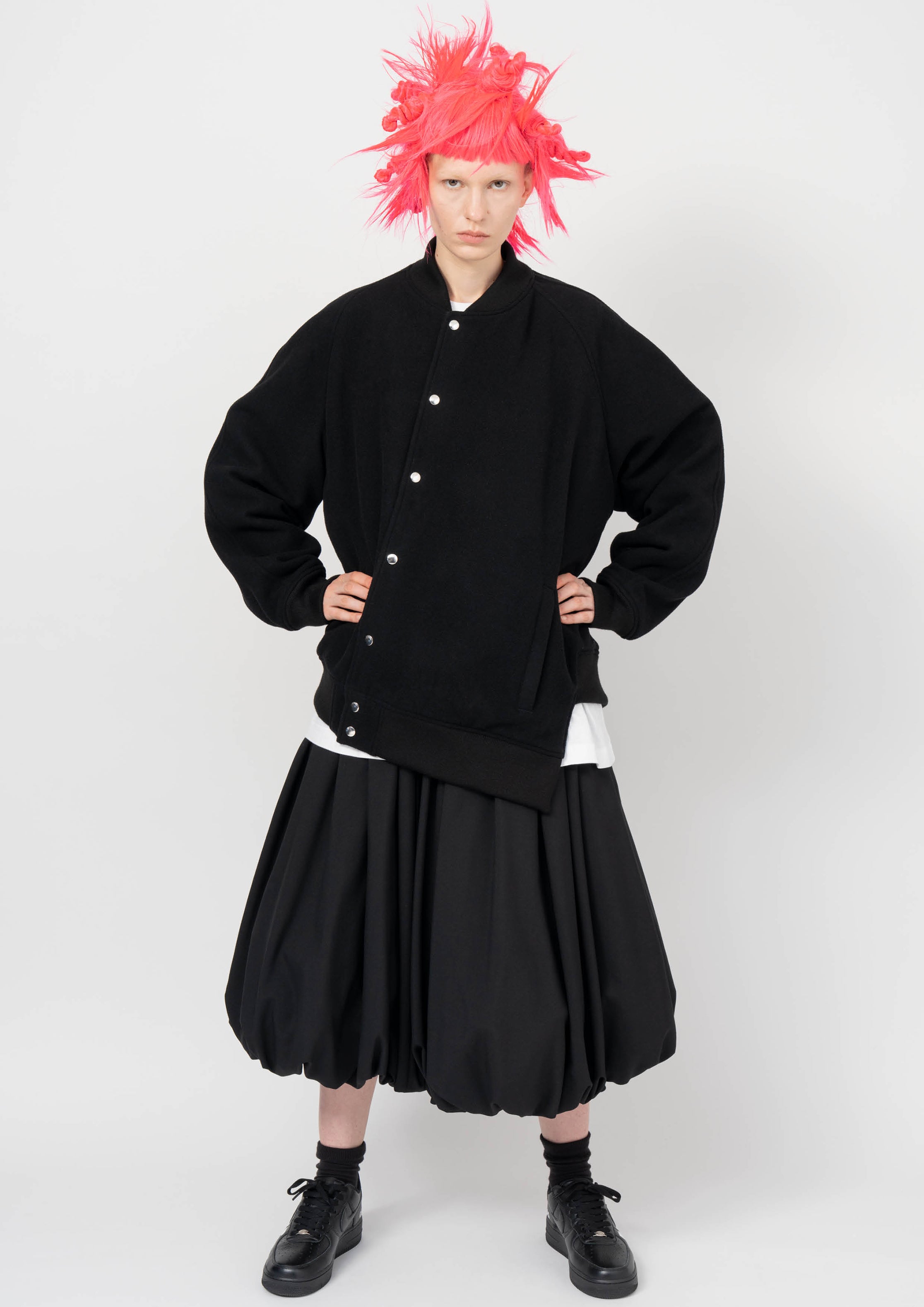 Fashion model wearing a BLACK COMME DES GARÇONS AW26 outfit
