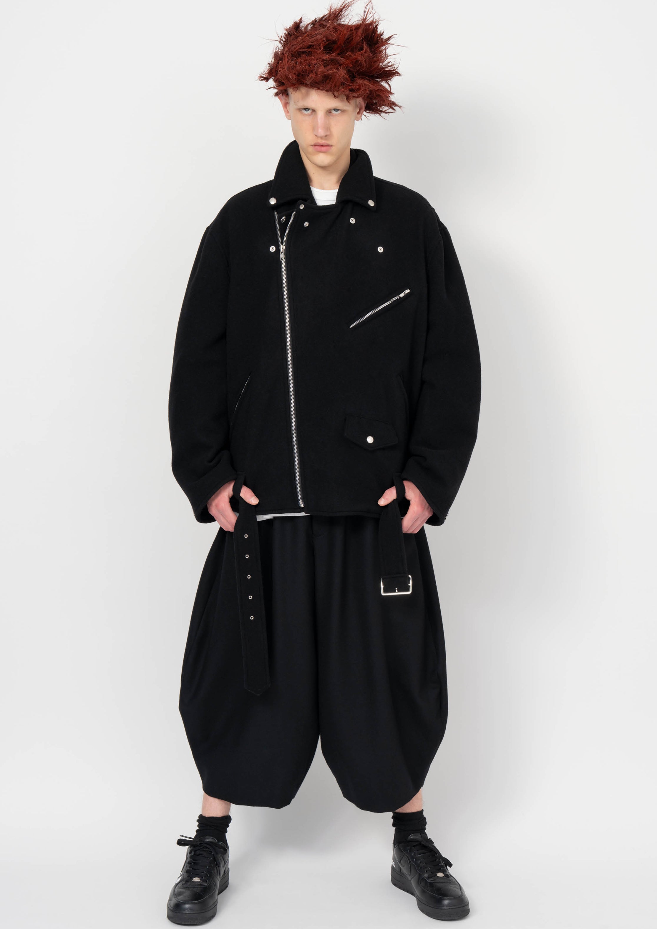 Fashion model wearing a BLACK COMME DES GARÇONS AW26 outfit