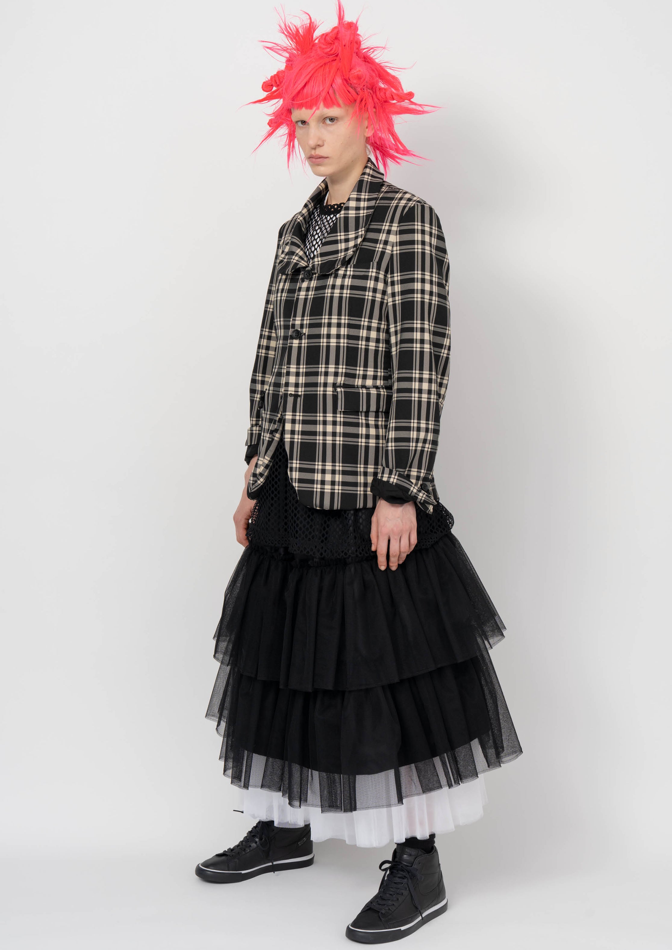 Fashion model wearing a BLACK COMME DES GARÇONS AW26 outfit