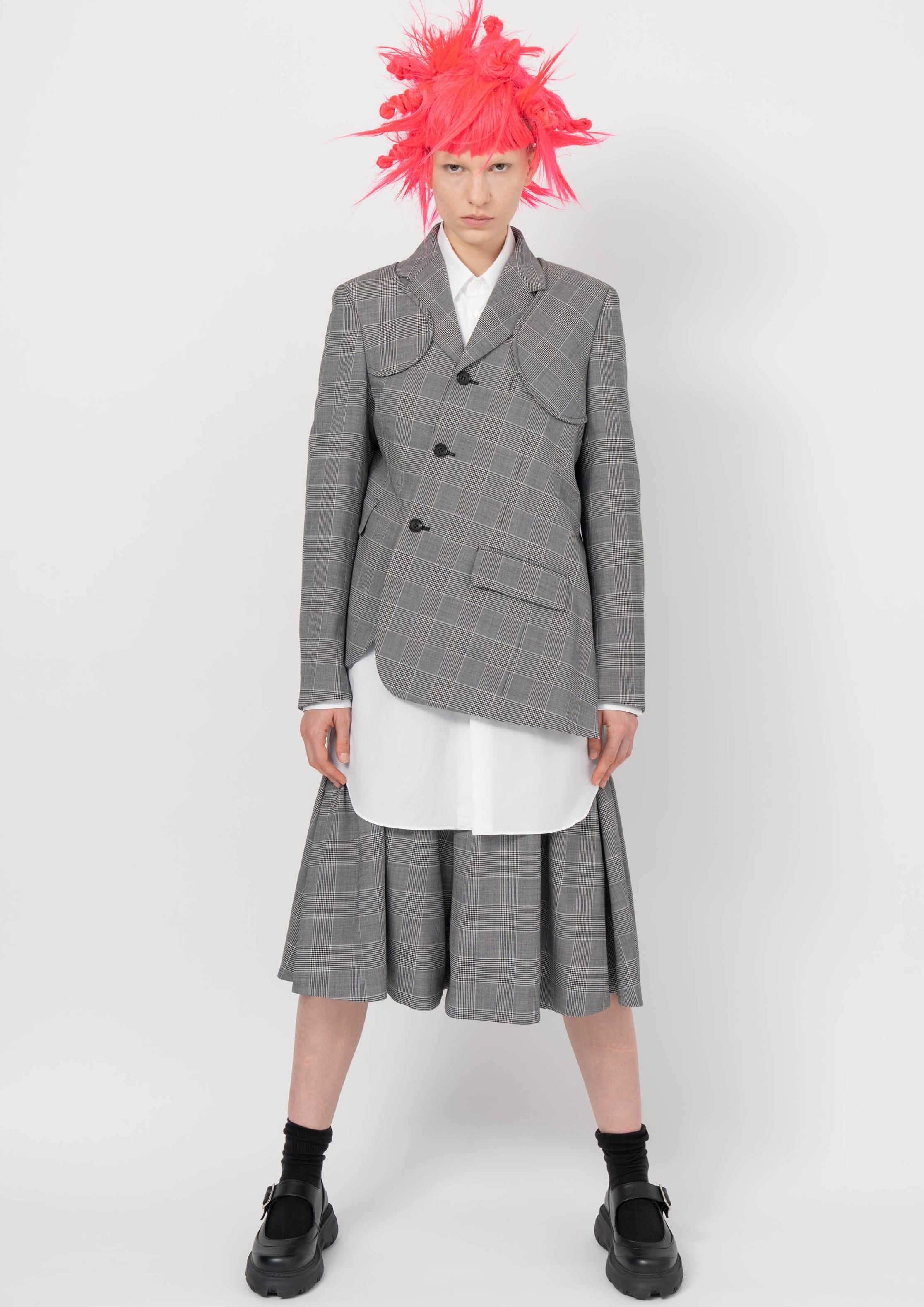 Fashion model wearing a BLACK COMME DES GARÇONS AW26 outfit