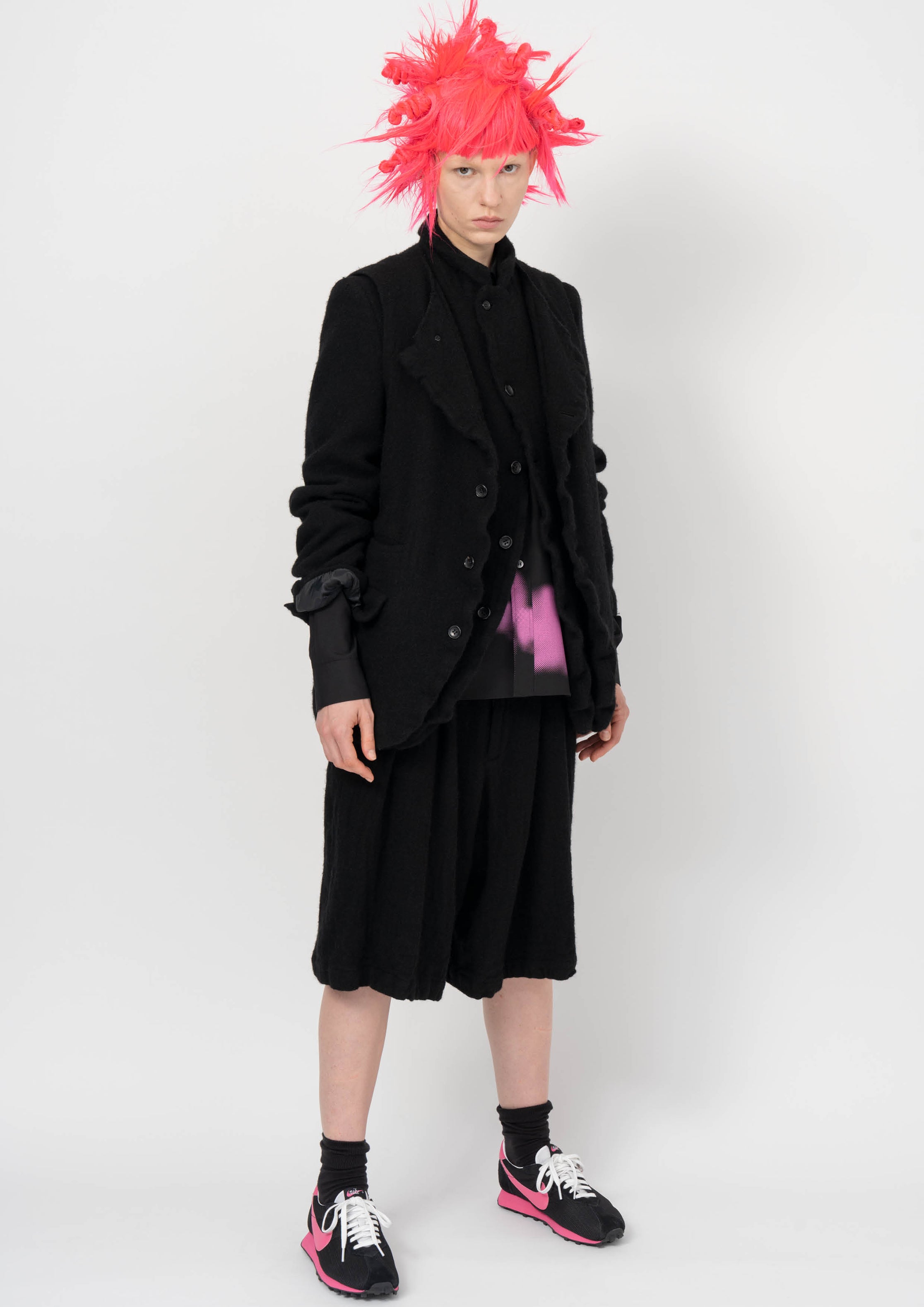 Fashion model wearing a BLACK COMME DES GARÇONS AW26 outfit