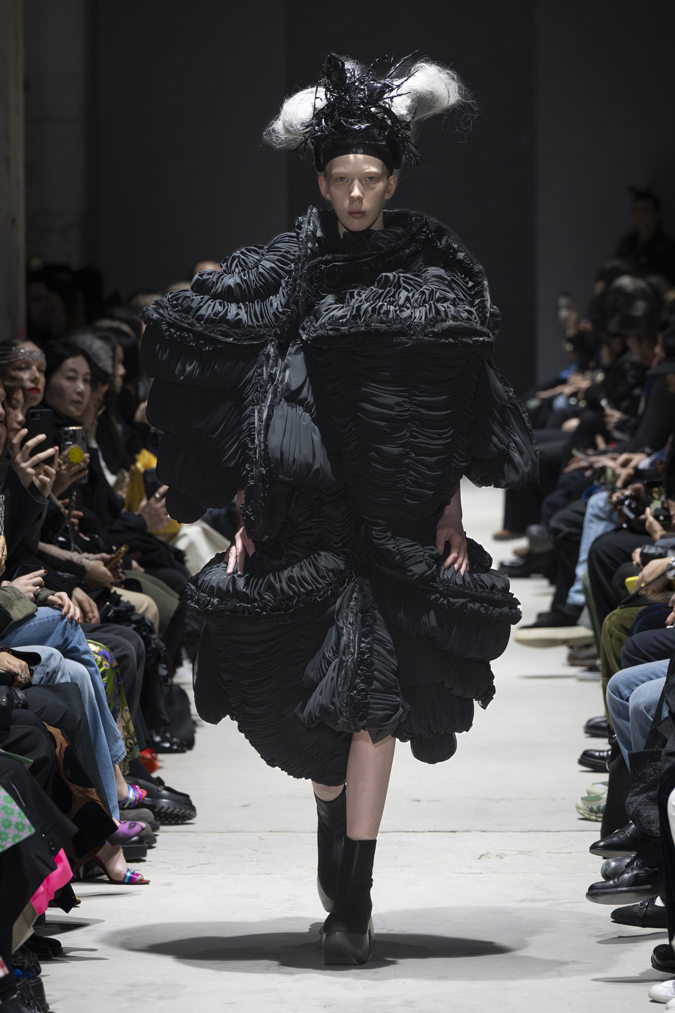 Fashion model wearing a Comme des Garçons AW26 outfit