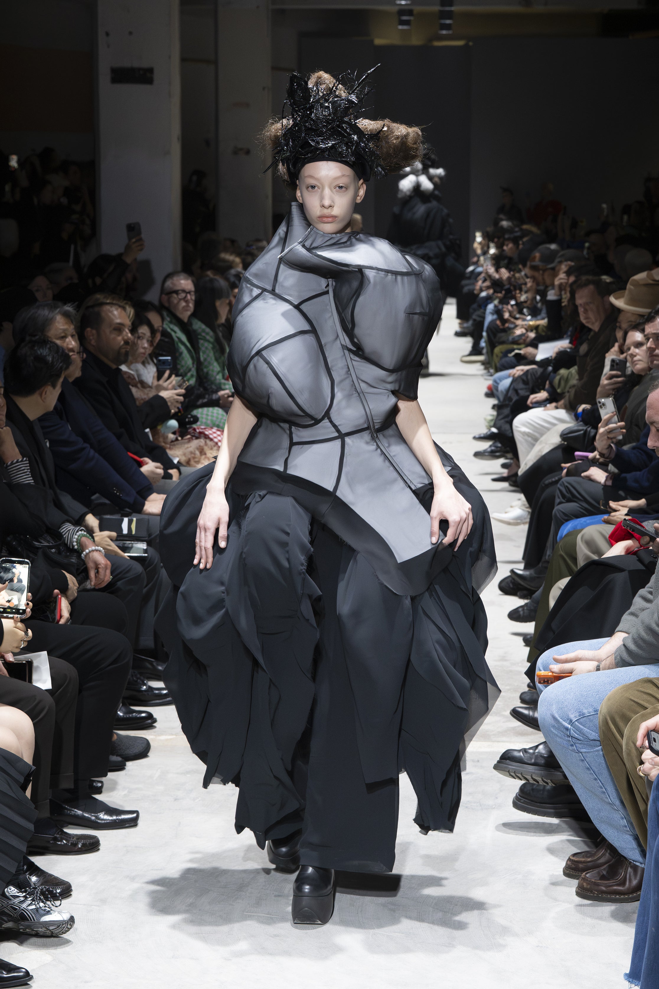 Fashion model wearing a Comme des Garçons AW26 outfit
