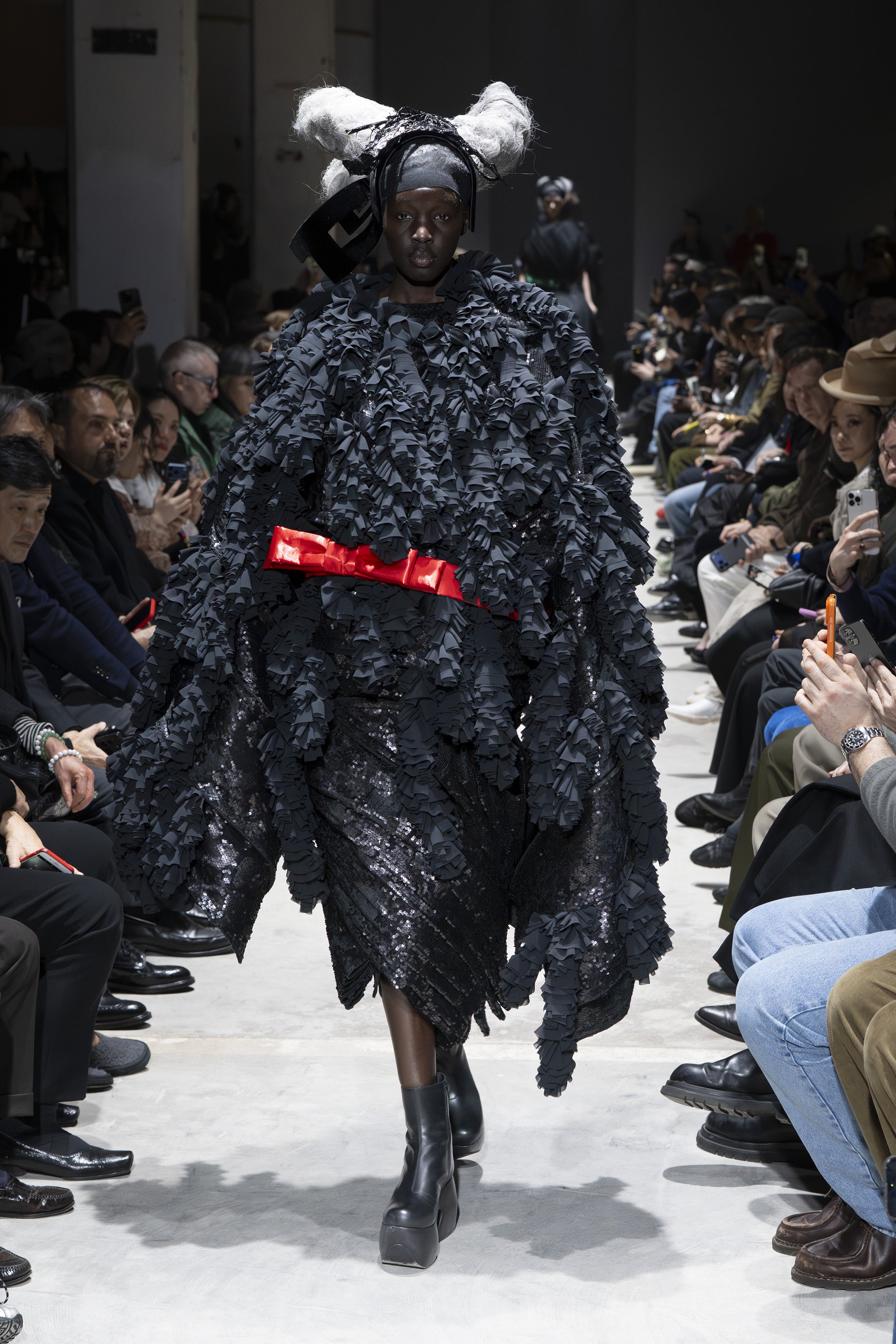 Fashion model wearing a Comme des Garçons AW26 outfit