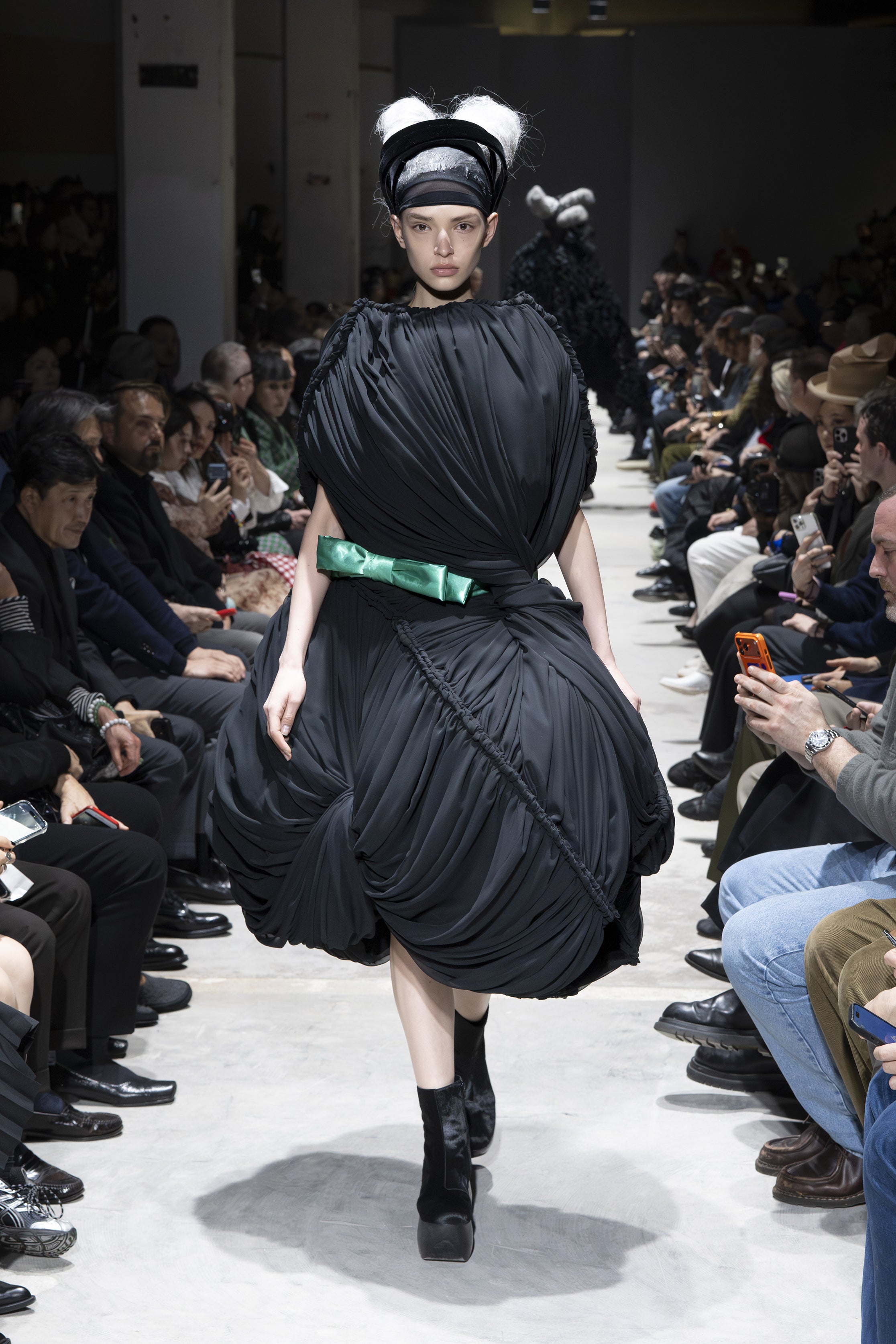 Fashion model wearing a Comme des Garçons AW26 outfit