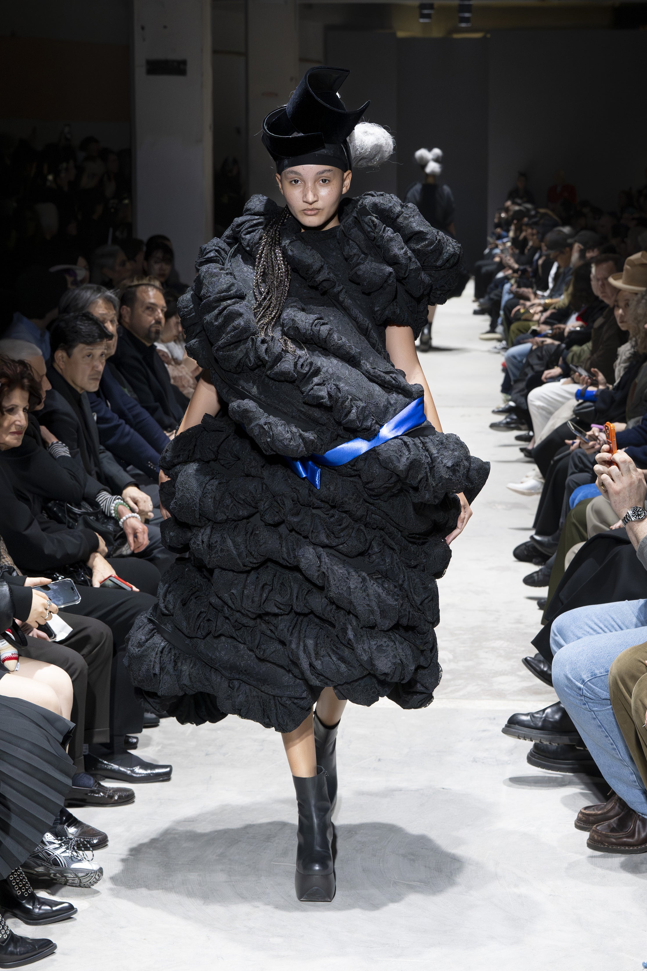 Fashion model wearing a Comme des Garçons AW26 outfit