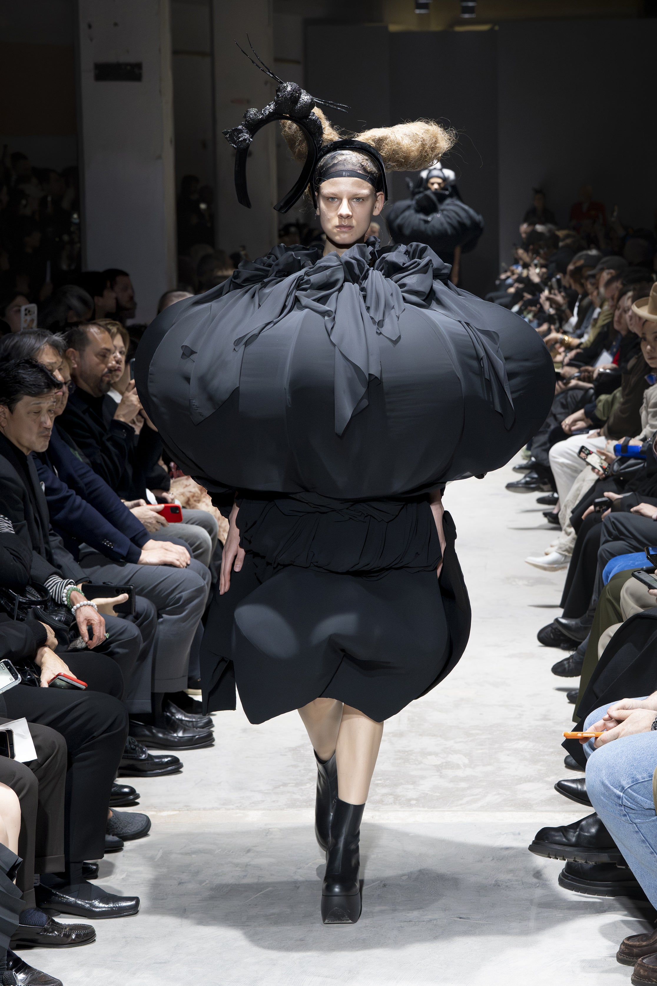 Fashion model wearing a Comme des Garçons AW26 outfit