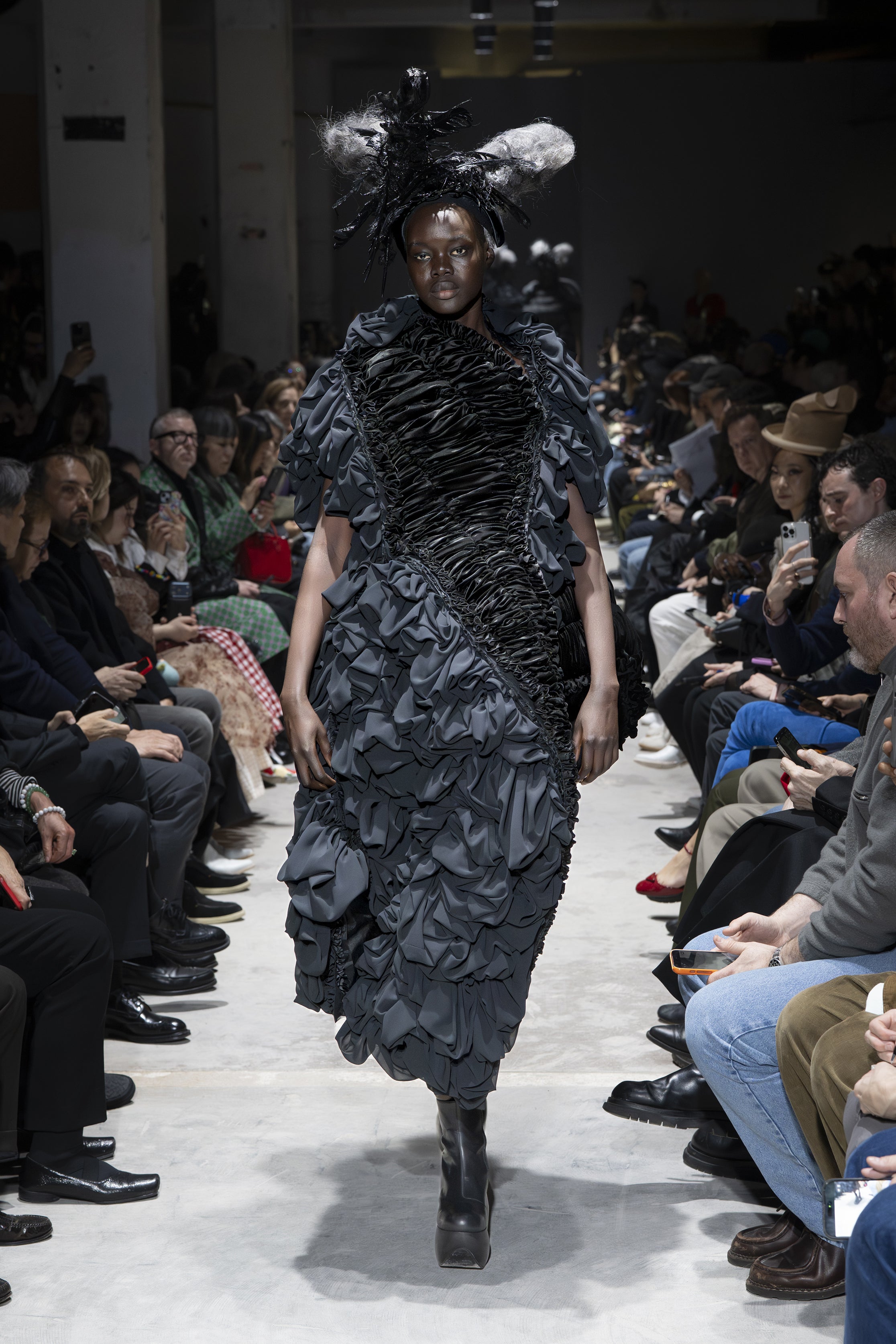 Fashion model wearing a Comme des Garçons AW26 outfit