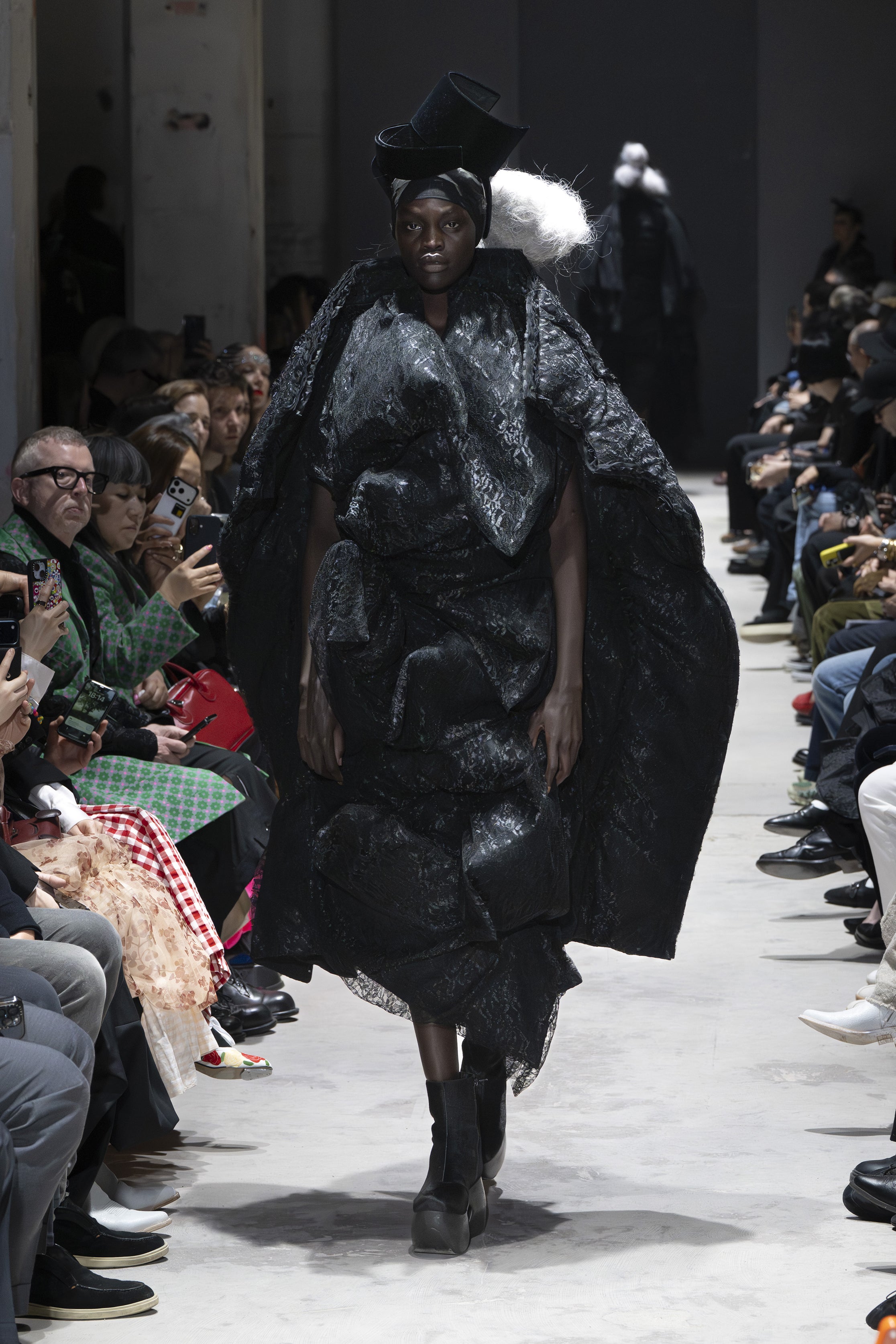 Fashion model wearing a Comme des Garçons AW26 outfit