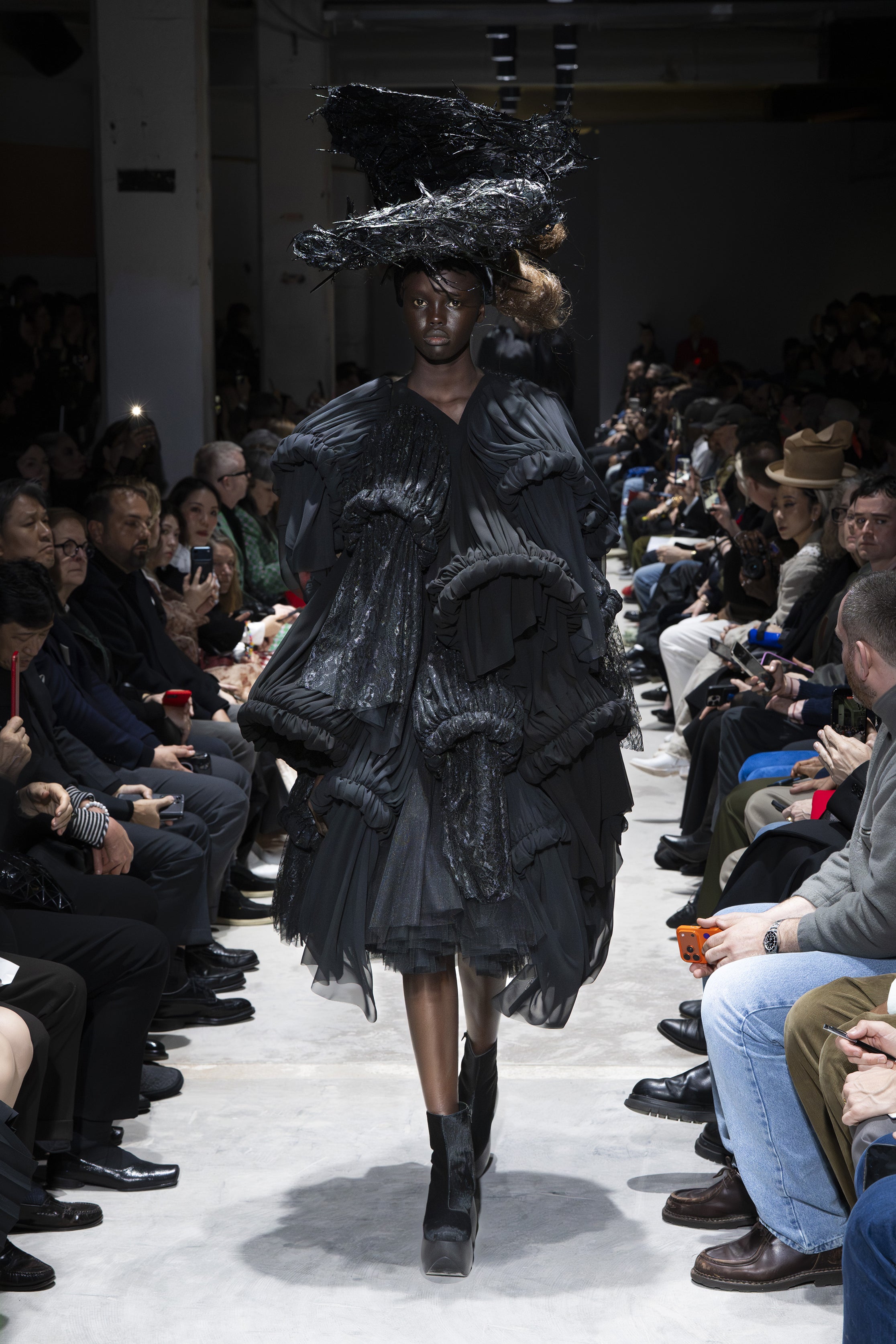 Fashion model wearing a Comme des Garçons AW26 outfit