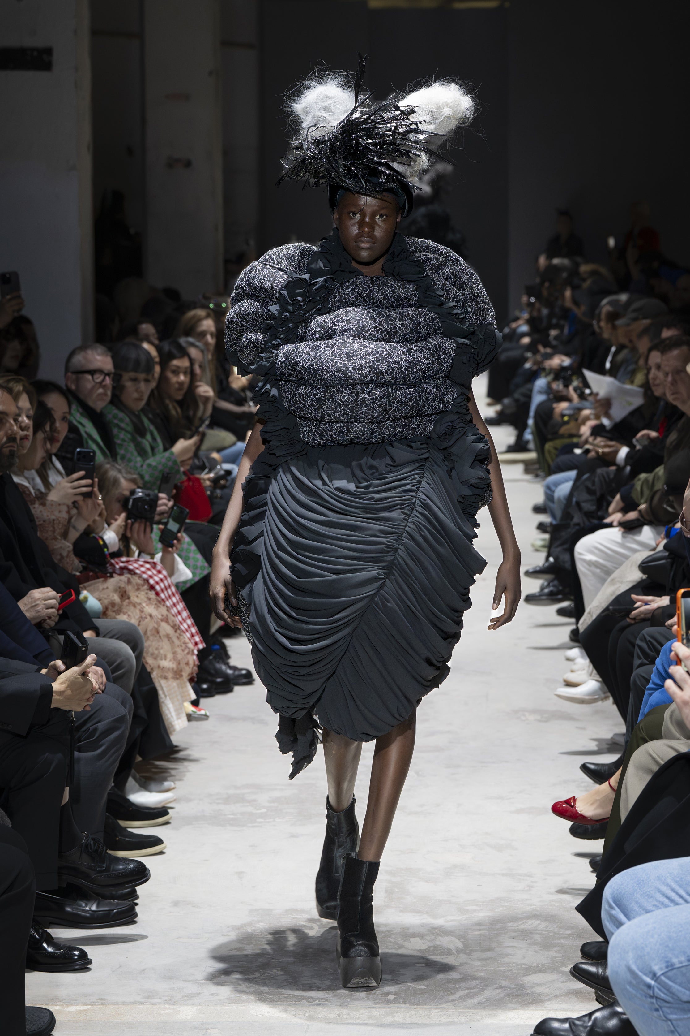 Fashion model wearing a Comme des Garçons AW26 outfit