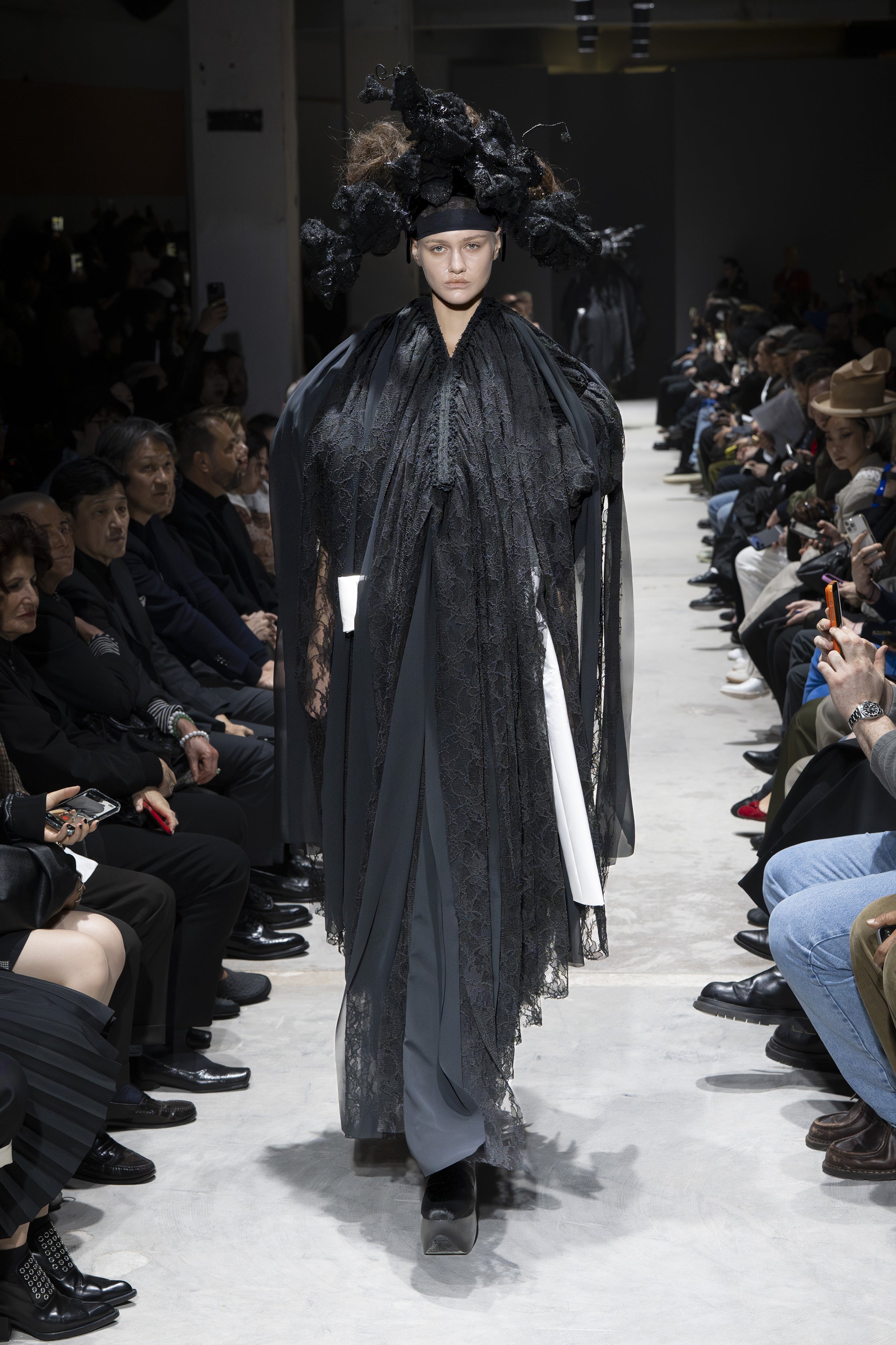 Fashion model wearing a Comme des Garçons AW26 outfit