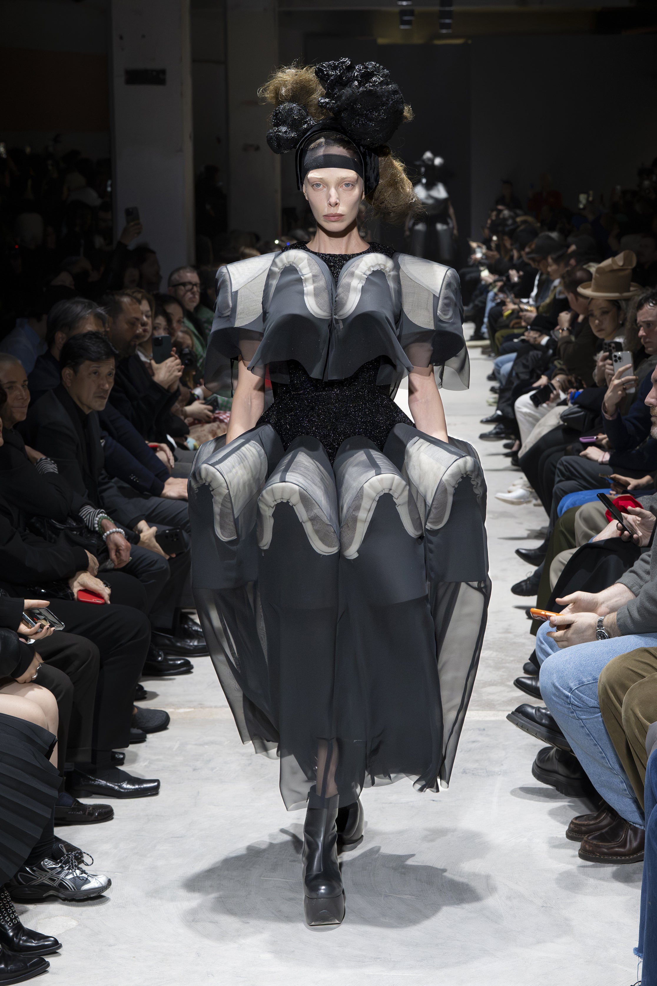 Fashion model wearing a Comme des Garçons AW26 outfit