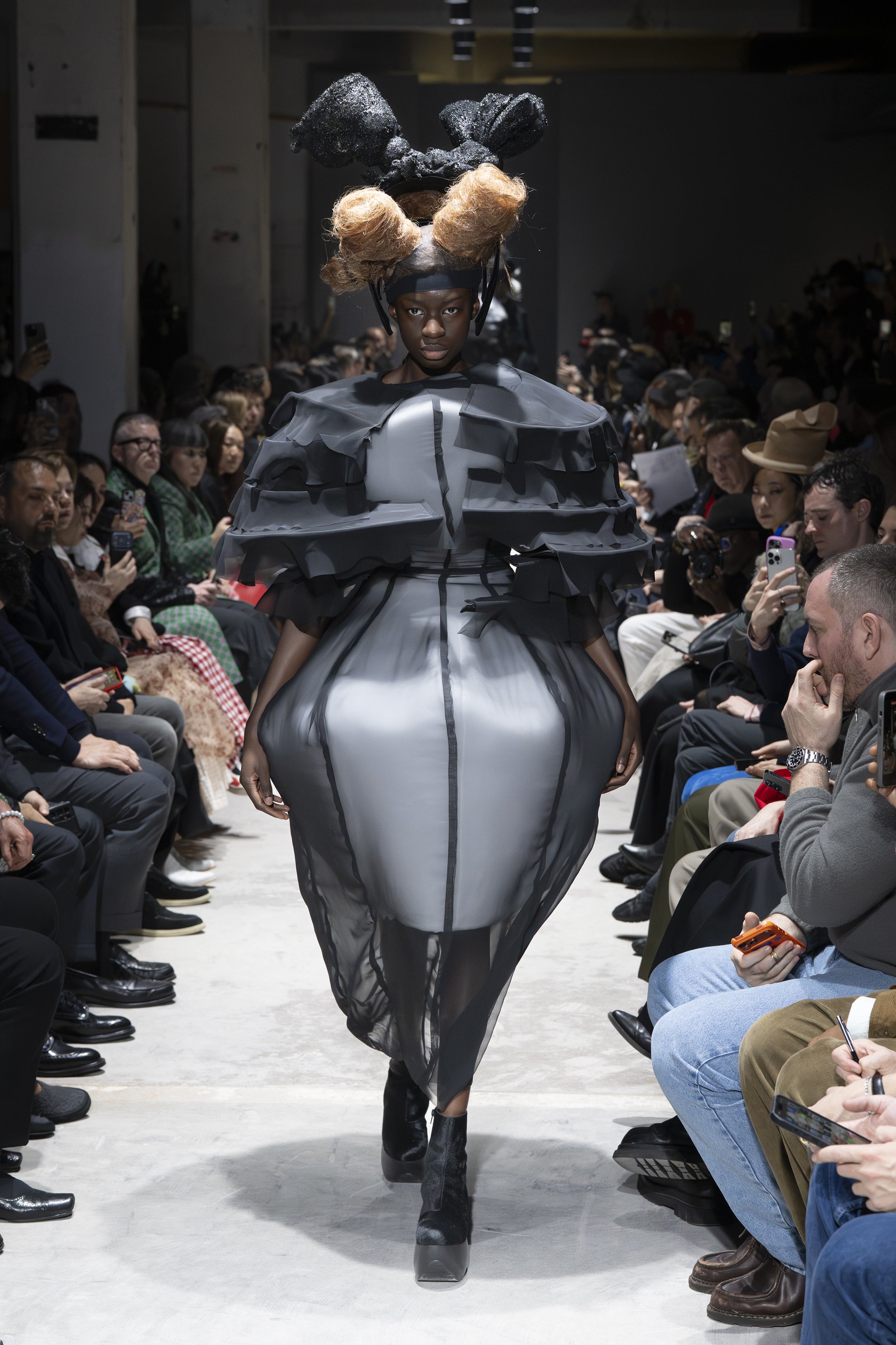 Fashion model wearing a Comme des Garçons AW26 outfit