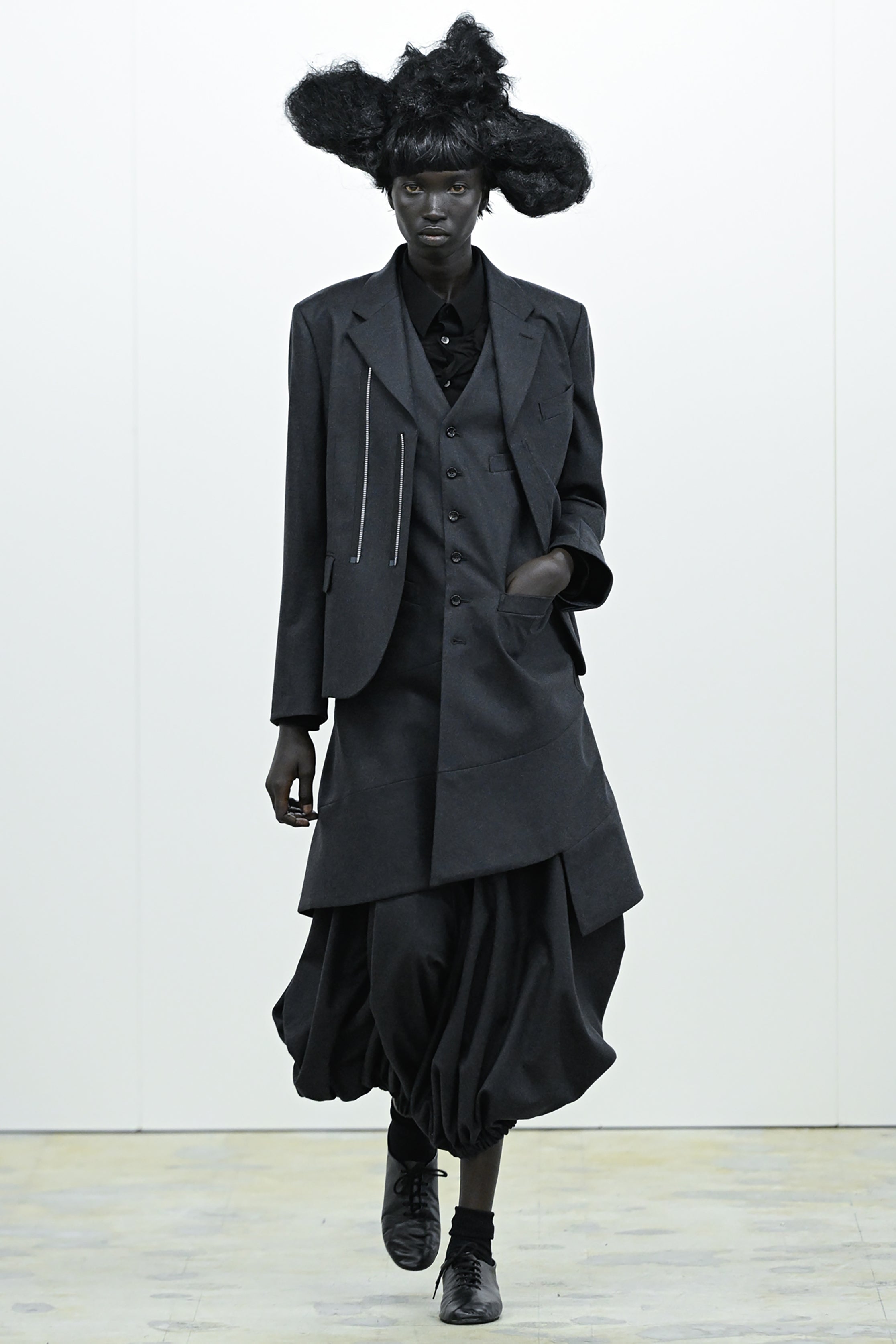 Fashion model wearing a COMME DES GARÇONS COMME DES GARÇONS AW26 outfit