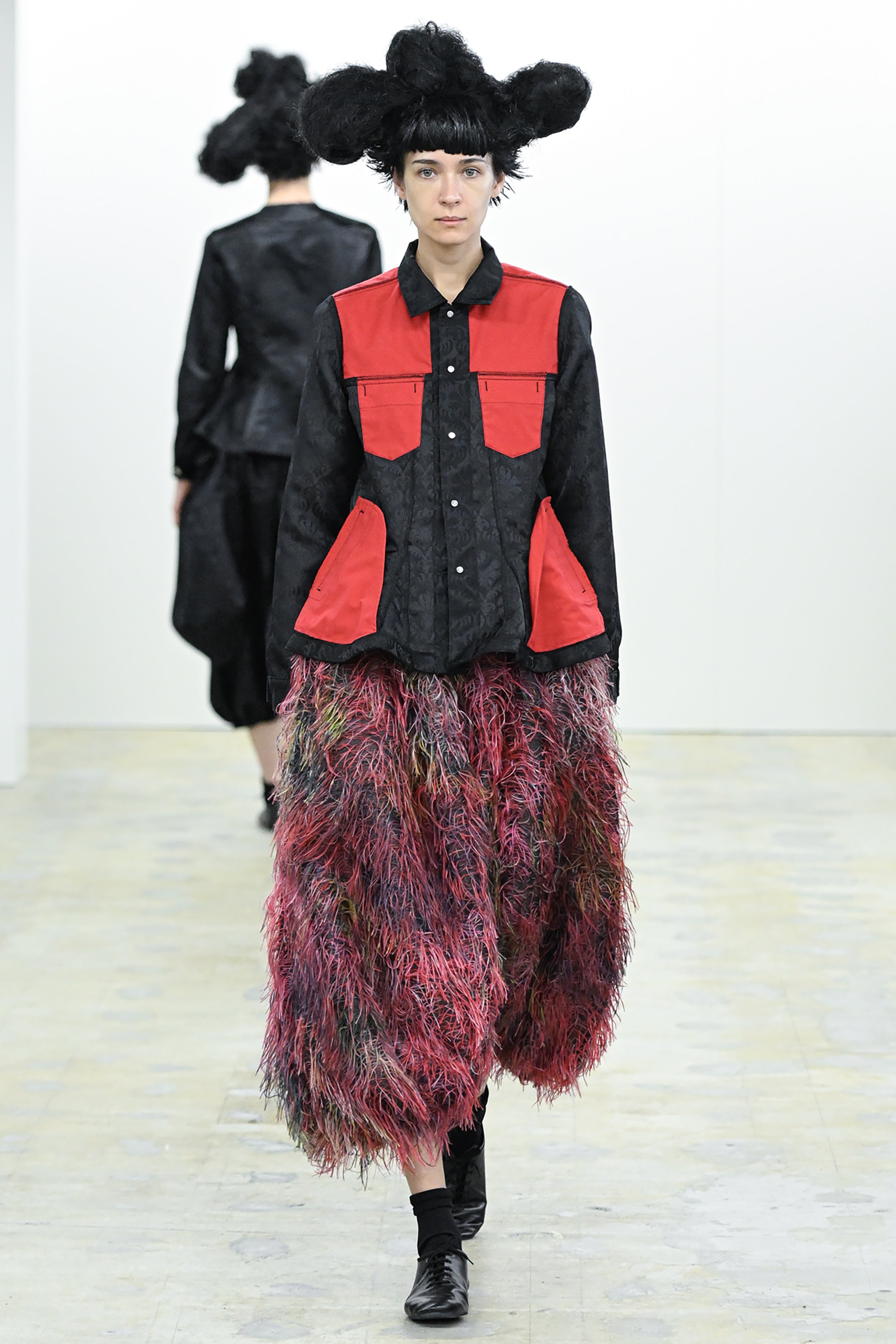 Fashion model wearing a COMME DES GARÇONS COMME DES GARÇONS AW26 outfit