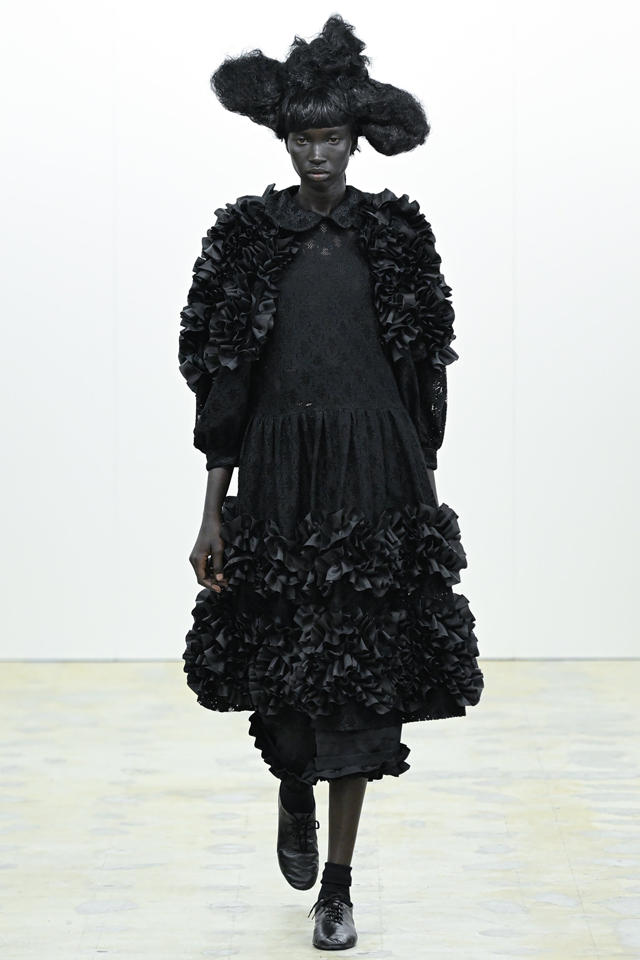 Fashion model wearing a COMME DES GARÇONS COMME DES GARÇONS AW26 outfit