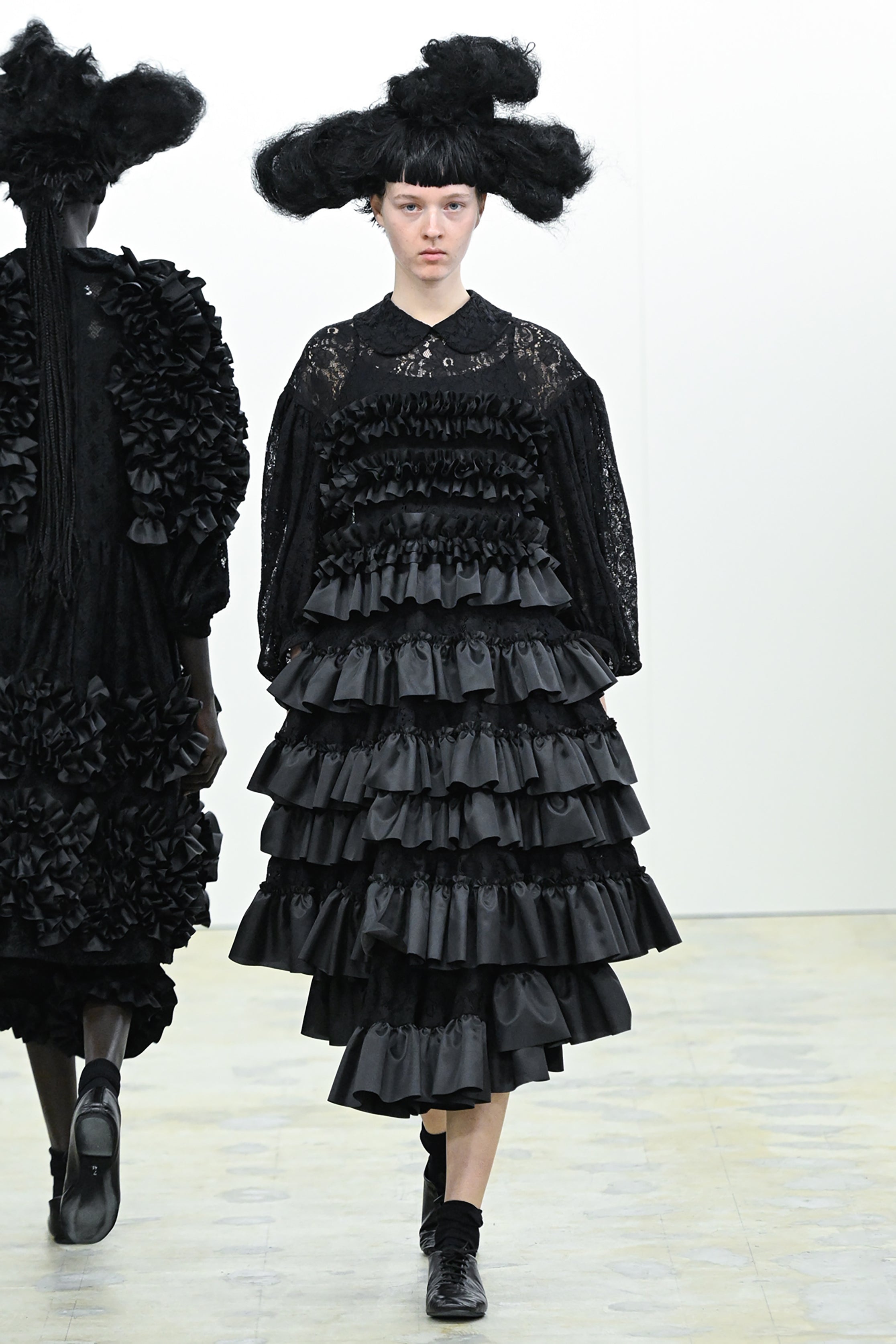 Fashion model wearing a COMME DES GARÇONS COMME DES GARÇONS AW26 outfit