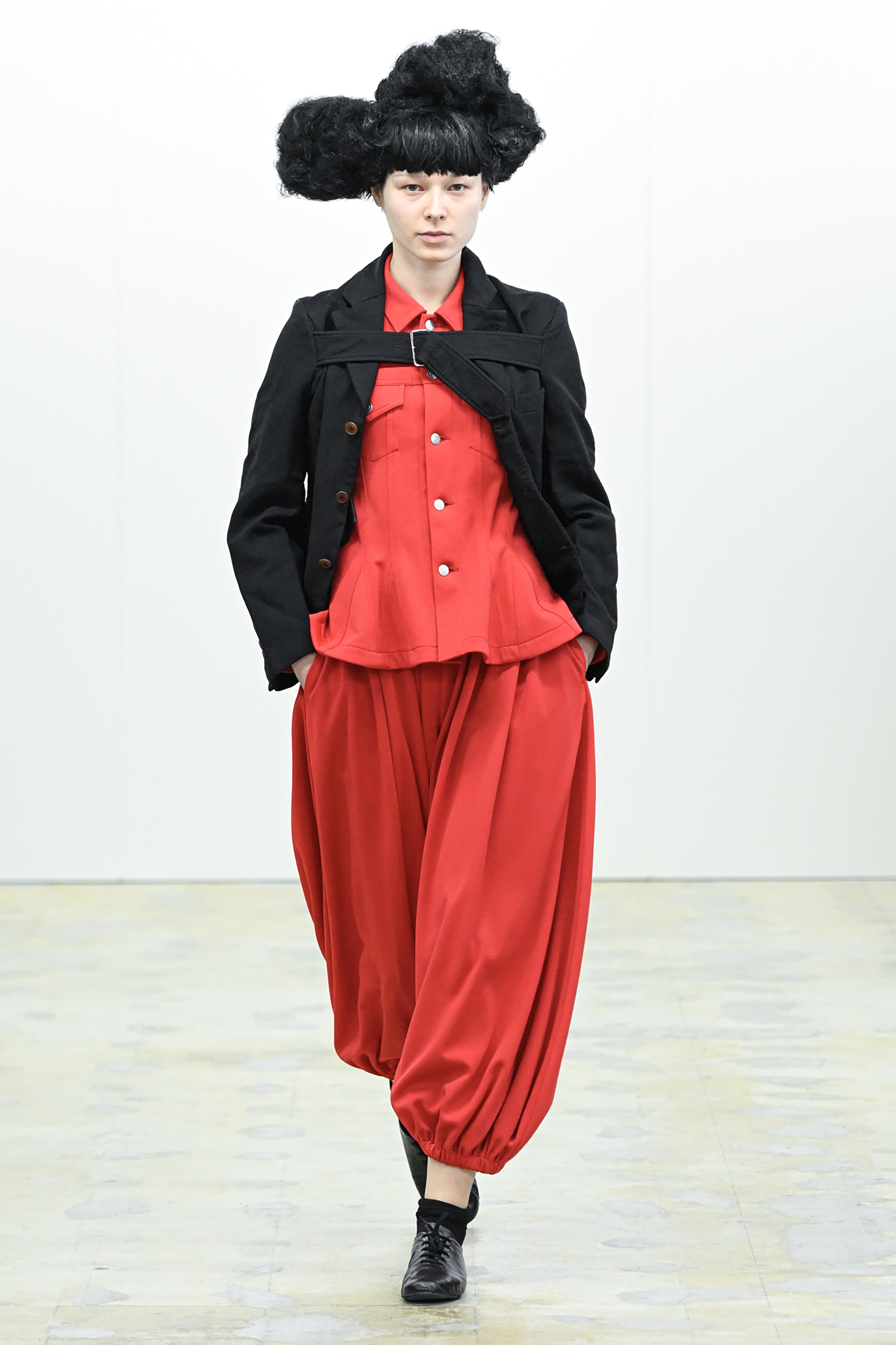 Fashion model wearing a COMME DES GARÇONS COMME DES GARÇONS AW26 outfit