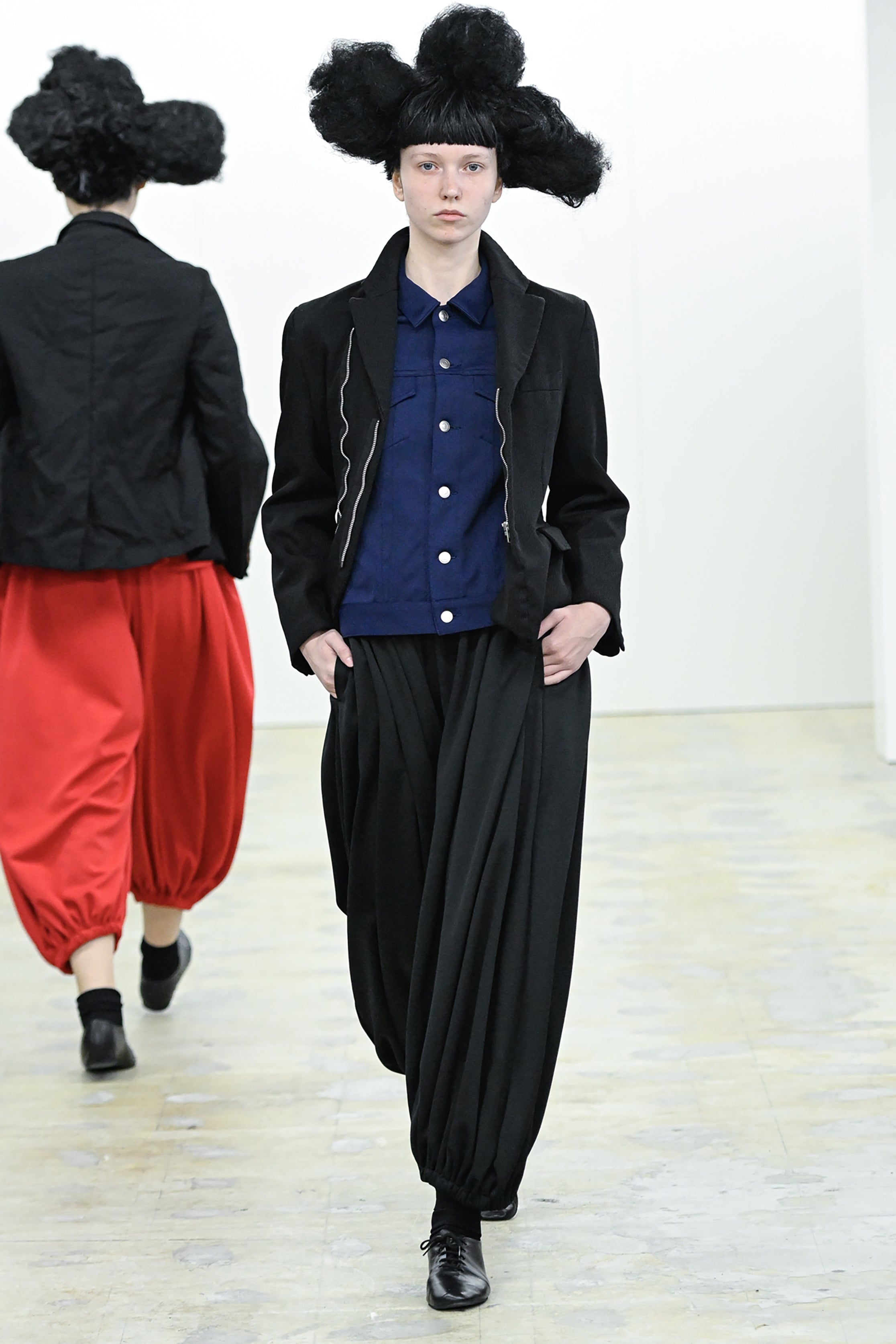 Fashion model wearing a COMME DES GARÇONS COMME DES GARÇONS AW26 outfit