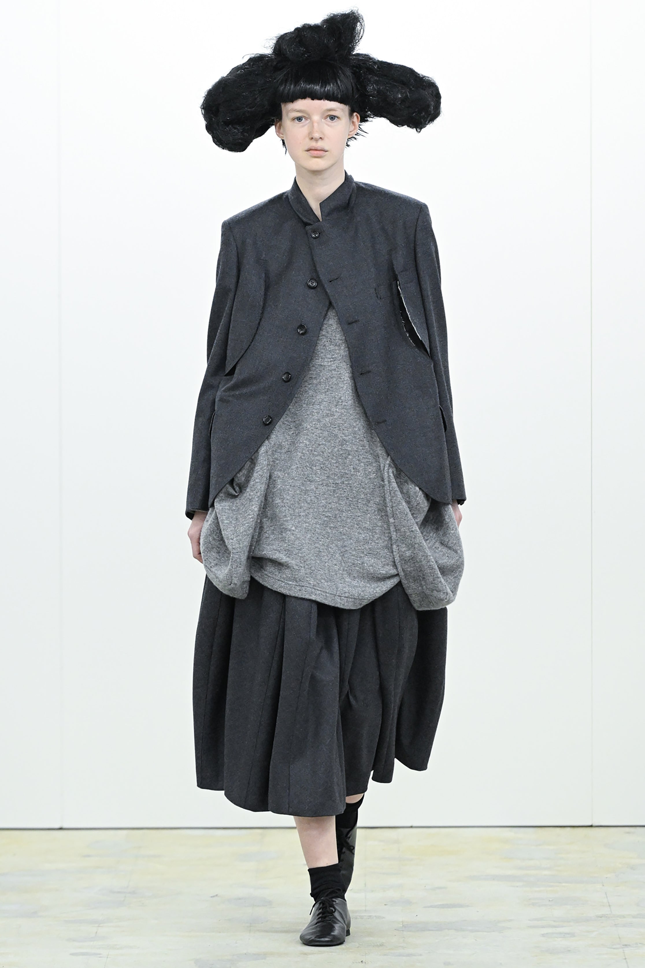 Fashion model wearing a COMME DES GARÇONS COMME DES GARÇONS AW26 outfit