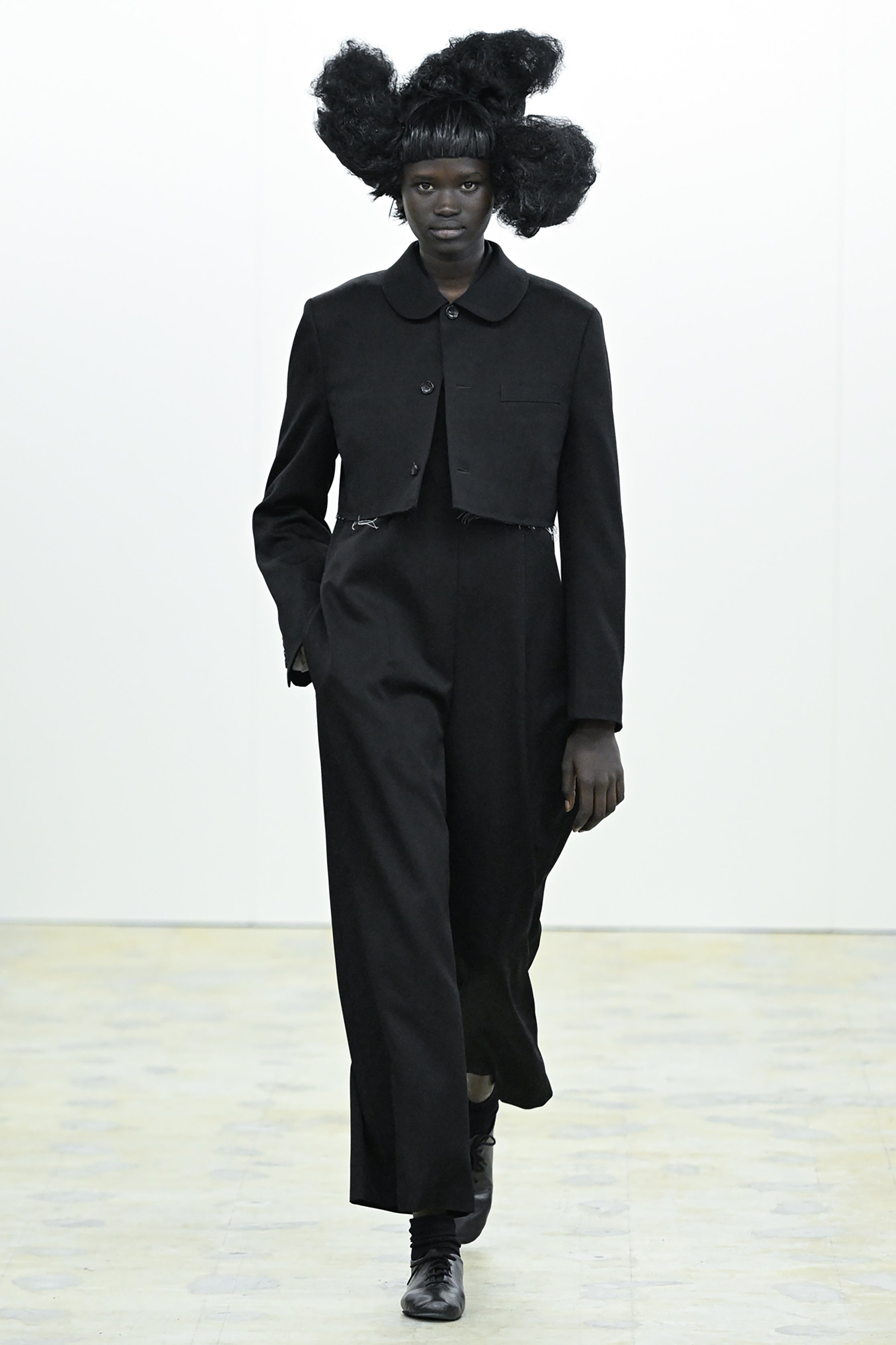 Fashion model wearing a COMME DES GARÇONS COMME DES GARÇONS AW26 outfit