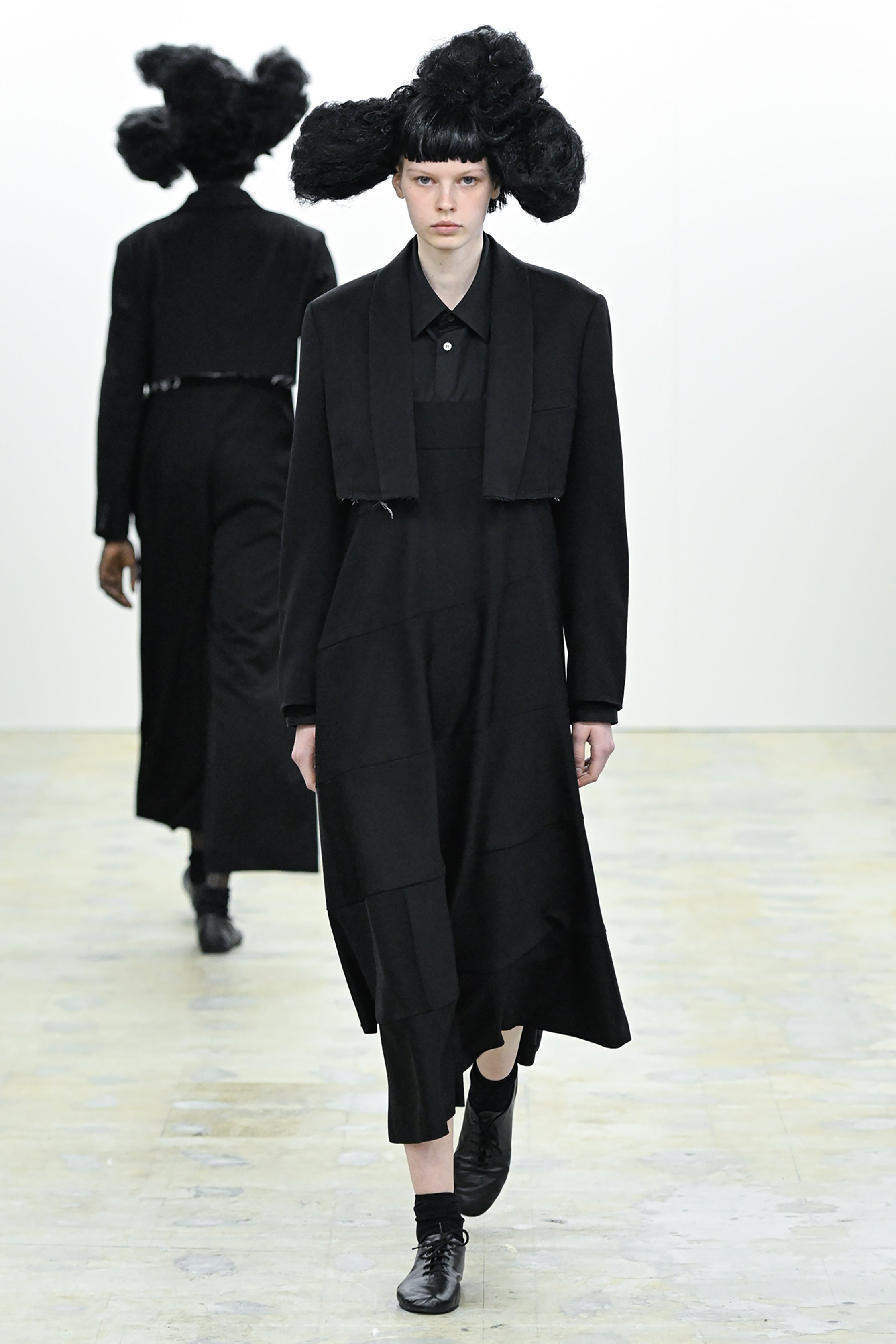 Fashion model wearing a COMME DES GARÇONS COMME DES GARÇONS AW26 outfit